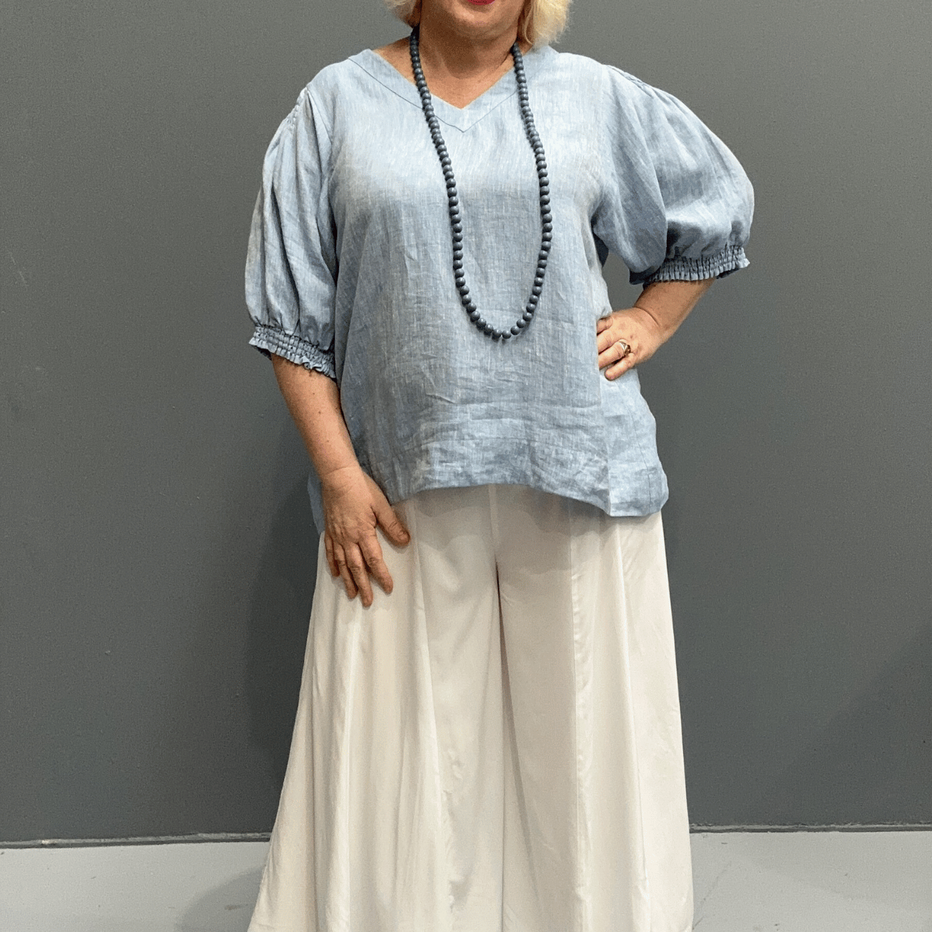 Plus size 'HOLLY' linen top with high-low hem and balloon sleeves for comfort and style.