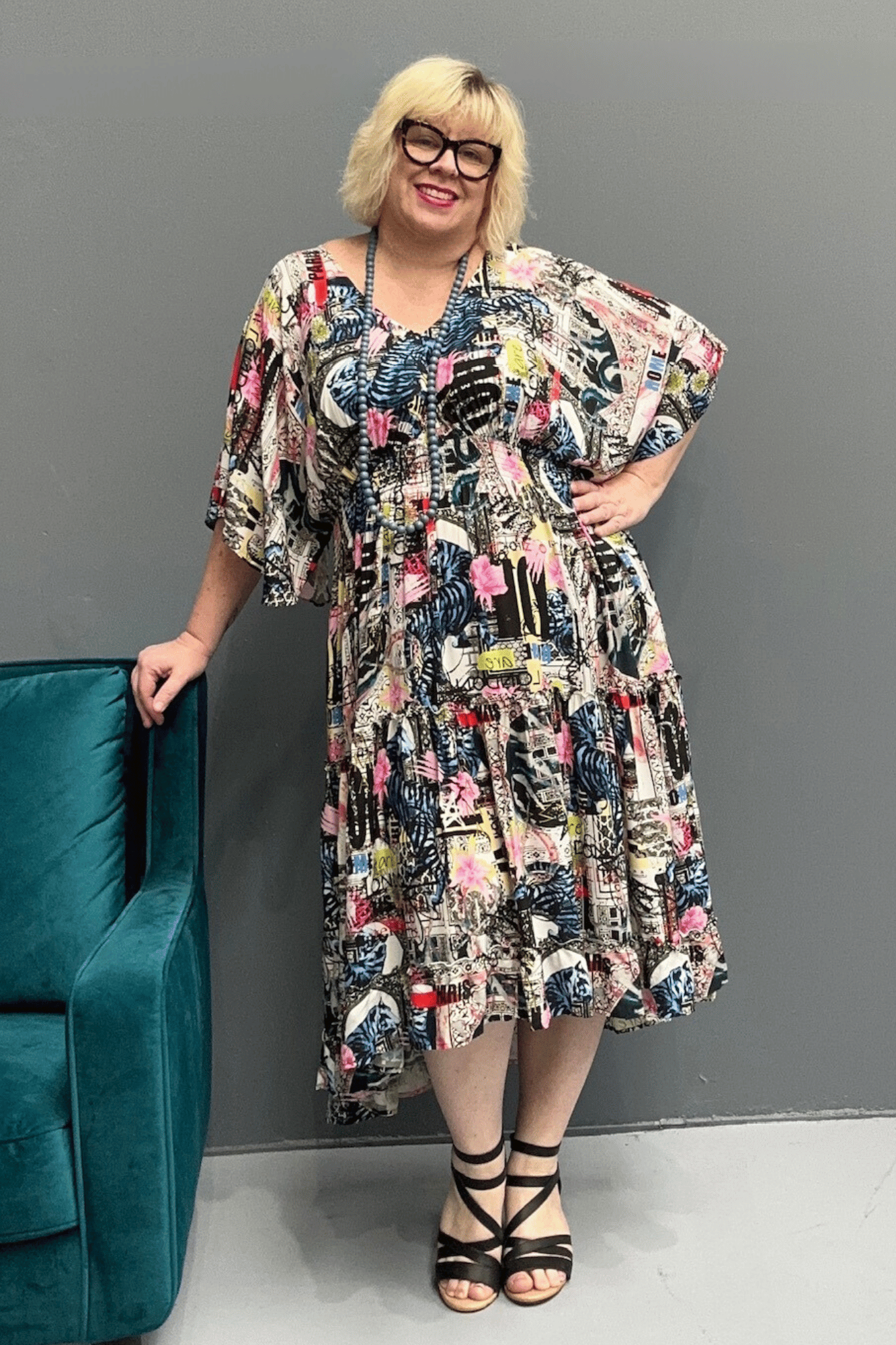 Floaty, tiered plus size dress for beach or casual outings, featuring a comfortable fit and versatile styling options.