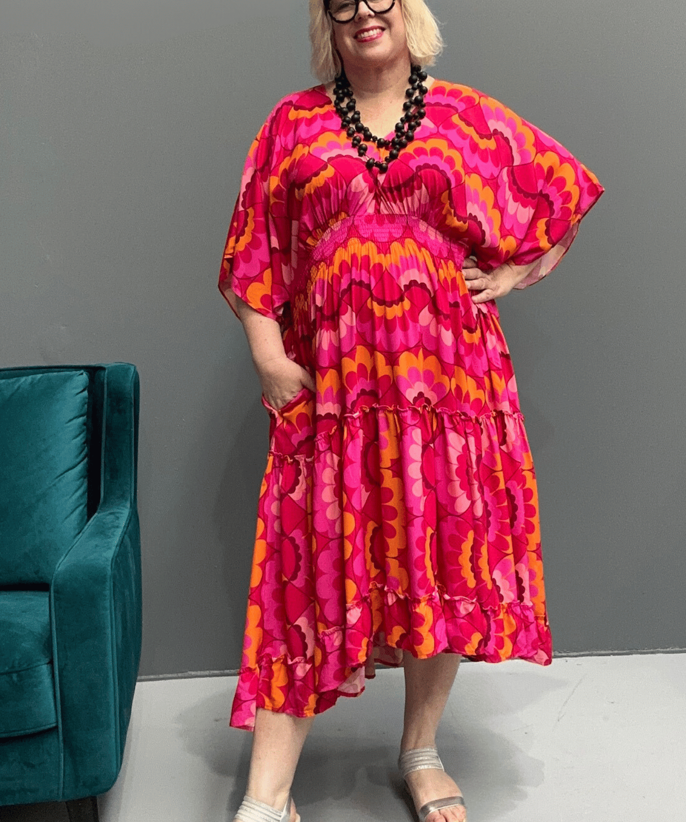 Floaty, tiered plus size dress for beach or casual outings, featuring a comfortable fit and versatile styling options.