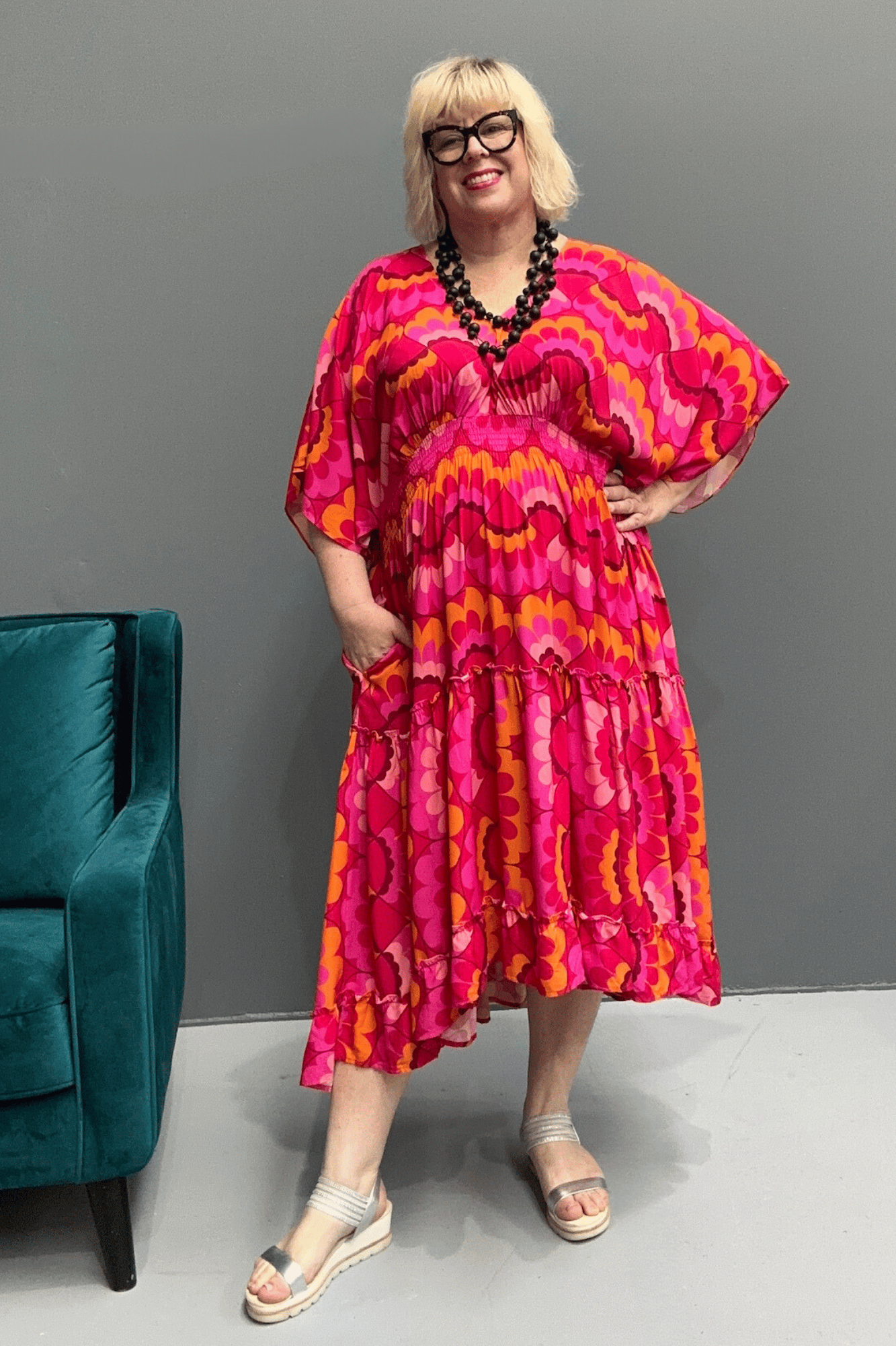 Floaty, tiered plus size dress for beach or casual outings, featuring a comfortable fit and versatile styling options.