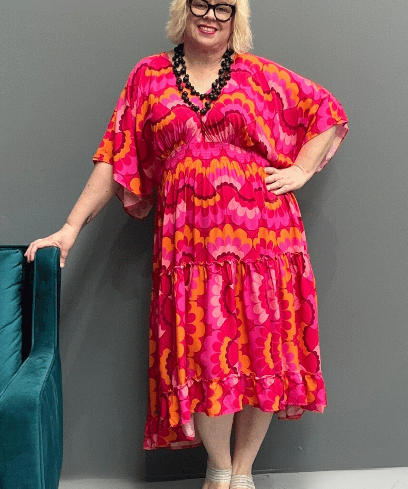 Floaty, tiered plus size dress for beach or casual outings, featuring a comfortable fit and versatile styling options.