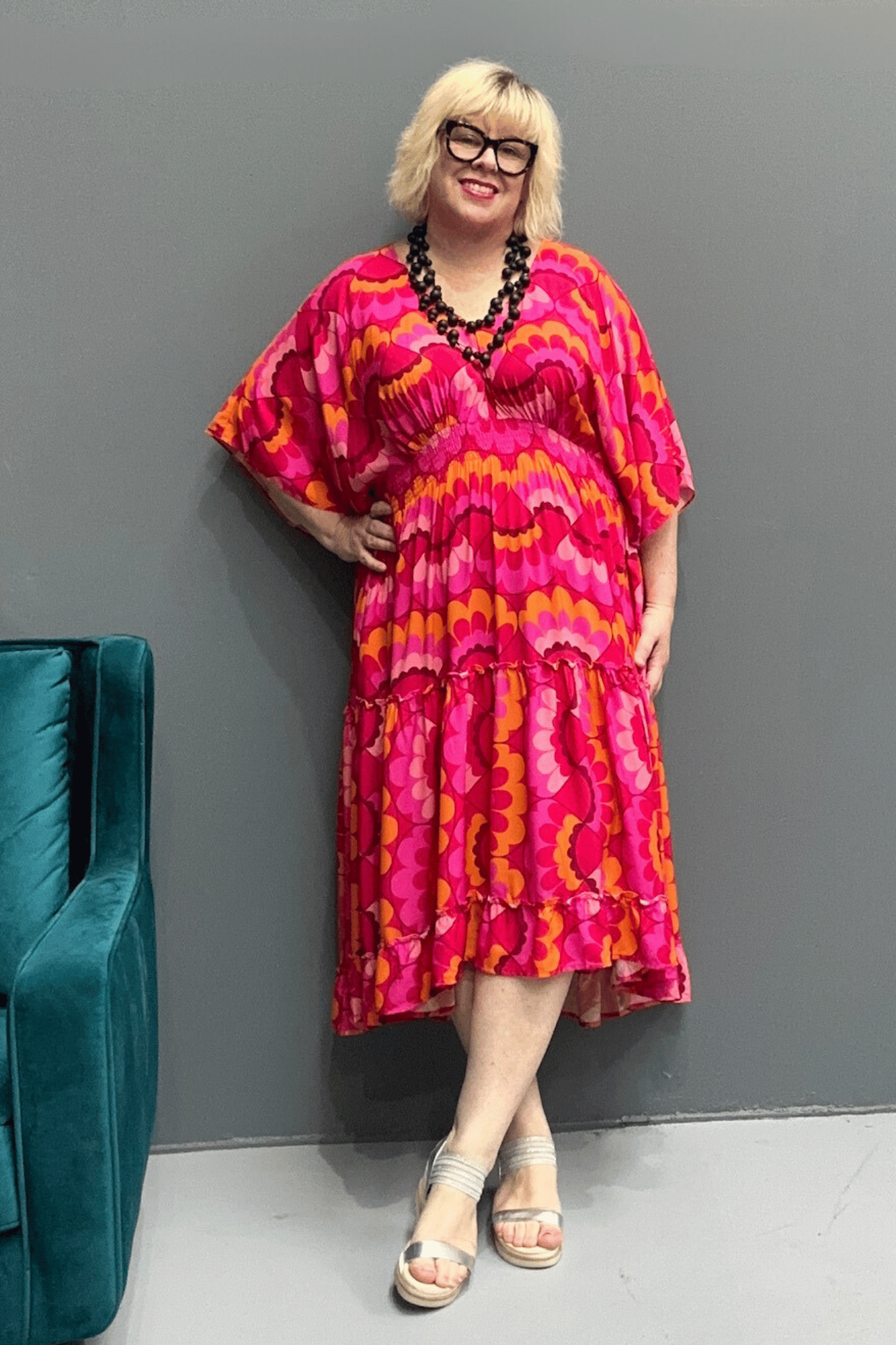 Floaty, tiered plus size dress for beach or casual outings, featuring a comfortable fit and versatile styling options.