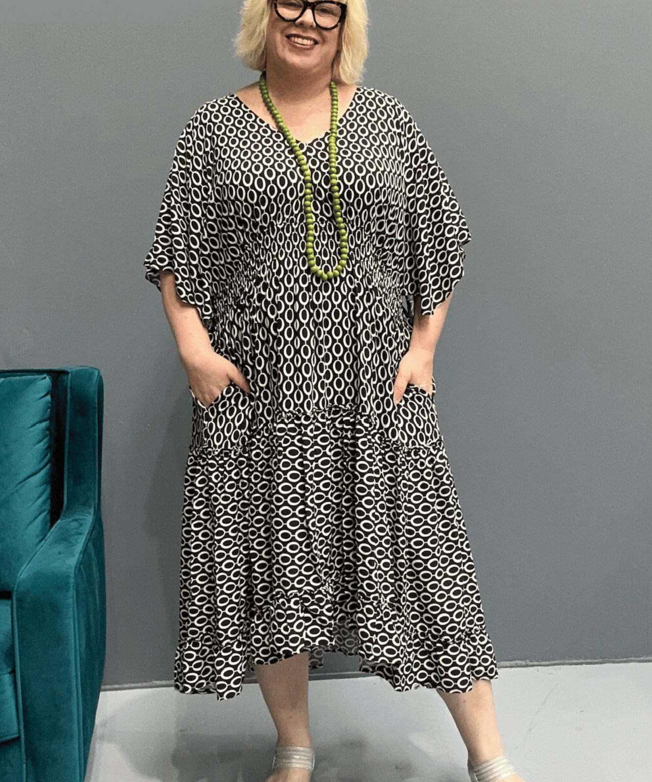 Floaty tiered dress perfect for plus size women, featuring shirring for comfort and a flattering shape, ideal for casual outings or dressing up.