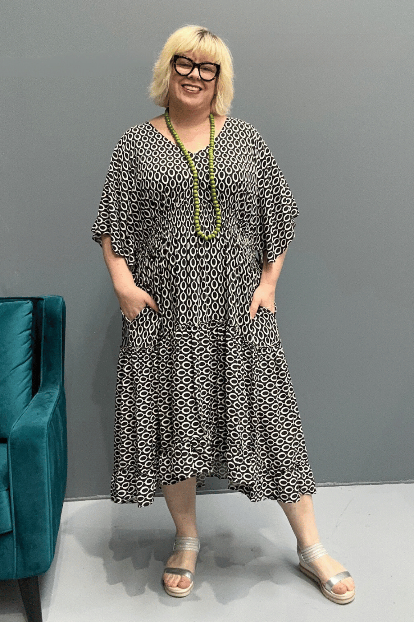 Floaty tiered dress perfect for plus size women, featuring shirring for comfort and a flattering shape, ideal for casual outings or dressing up.