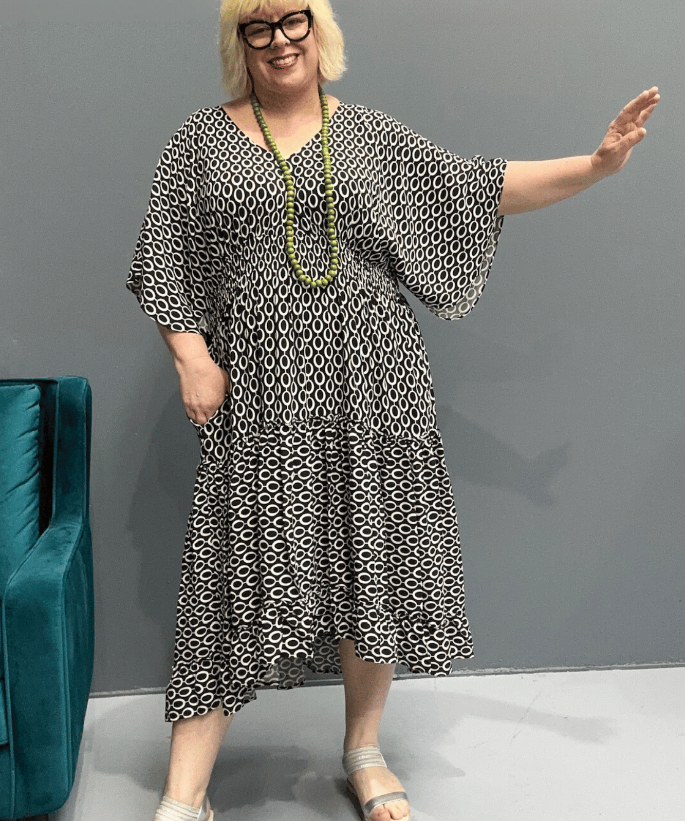 Floaty tiered dress perfect for plus size women, featuring shirring for comfort and a flattering shape, ideal for casual outings or dressing up.