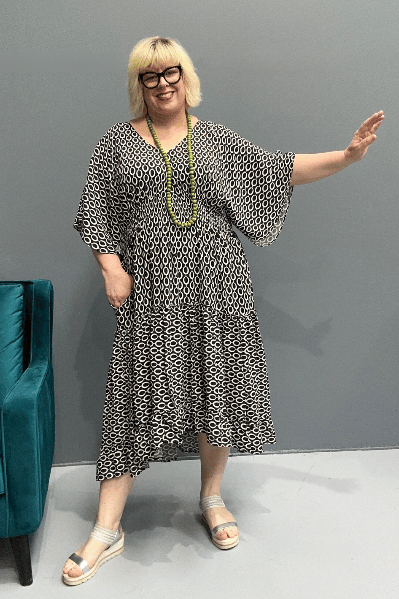 Floaty tiered dress perfect for plus size women, featuring shirring for comfort and a flattering shape, ideal for casual outings or dressing up.