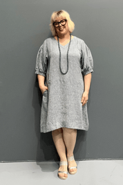 Plus size 'HAYLEY' dress with flowing silhouette and balloon sleeves for comfort on warm days.