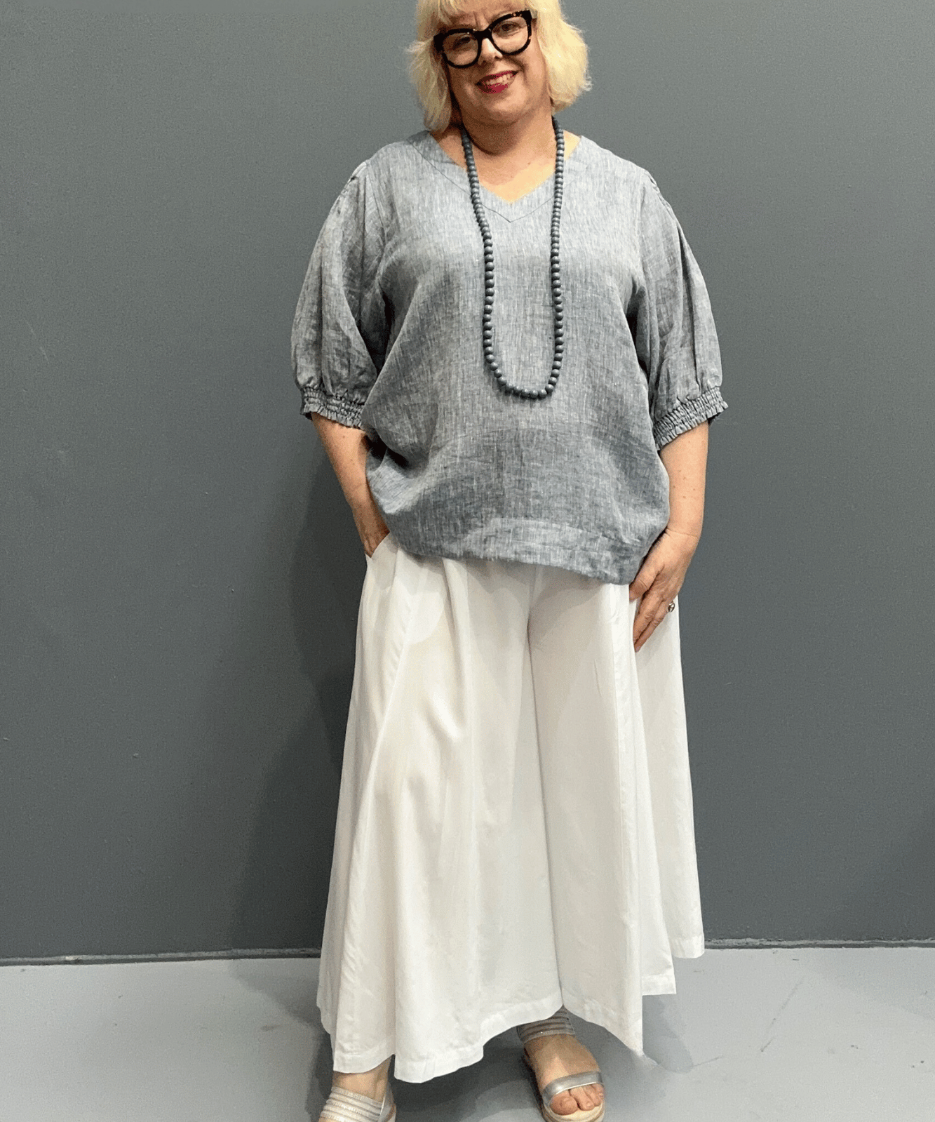 'Holly' plus size linen top with a high-low hem, balloon sleeves, and dropped armholes for comfort and airflow.