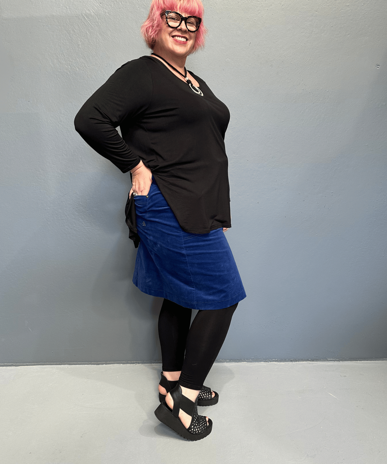 Plus size 'ADDICTED' long sleeve top with scoop neckline, side splits, and long sleeves