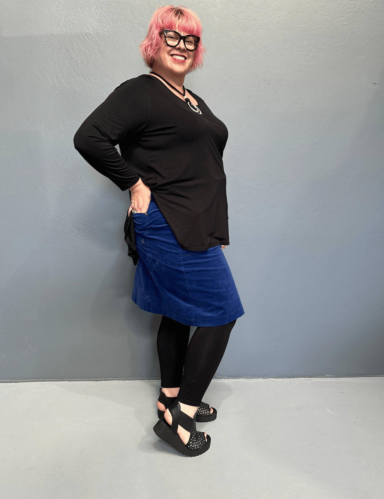 Plus size 'ADDICTED' long sleeve top with scoop neckline, side splits, and long sleeves