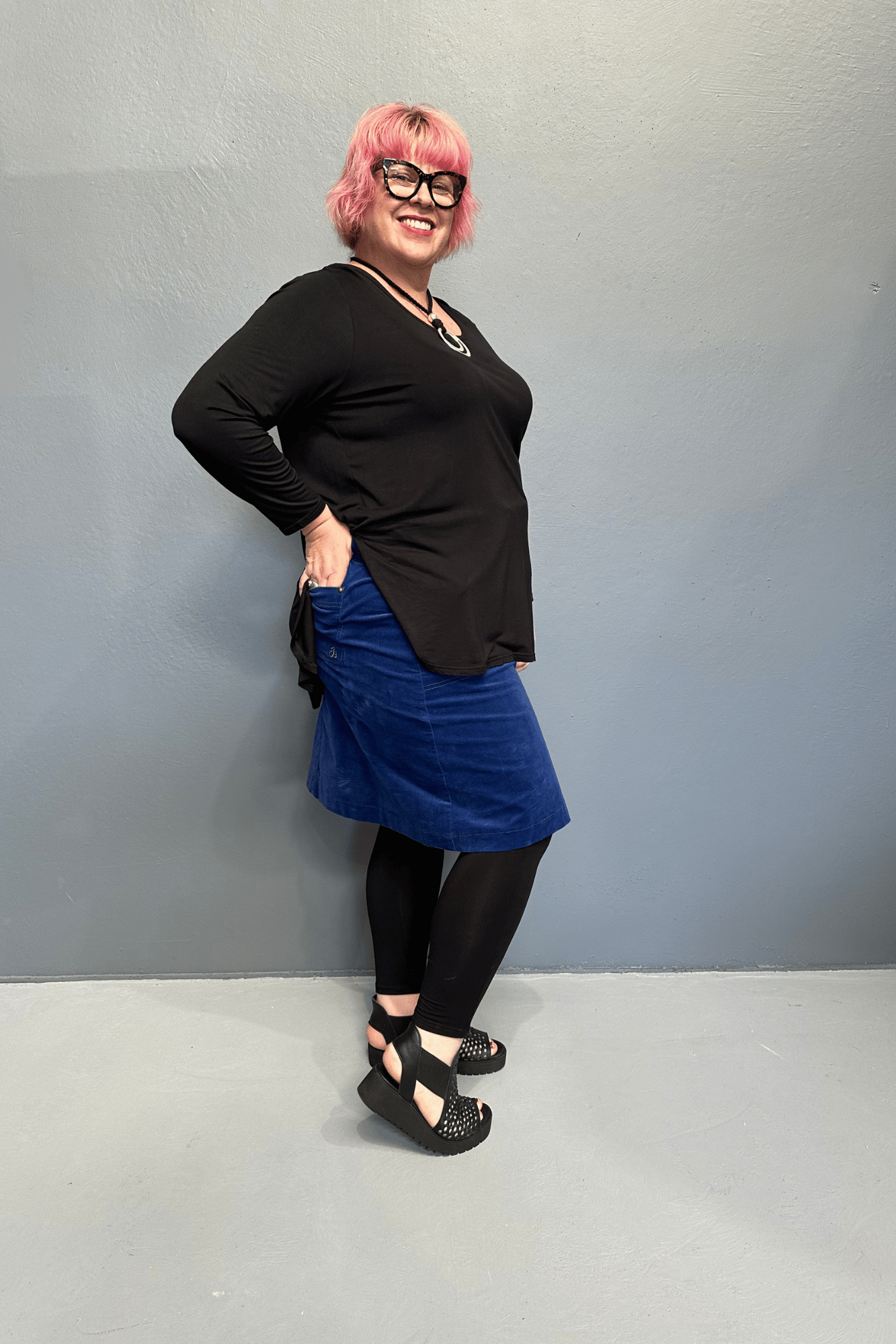 Plus size 'ADDICTED' long sleeve top with scoop neckline, side splits, and long sleeves