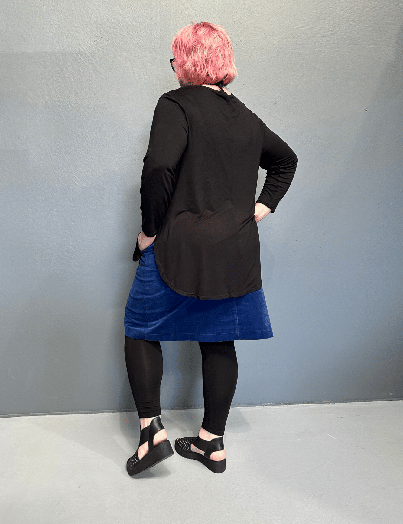 Plus size 'ADDICTED' long sleeve top with scoop neckline, side splits, and long sleeves