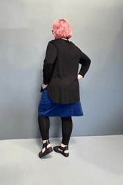 Plus size 'ADDICTED' long sleeve top with scoop neckline, side splits, and long sleeves
