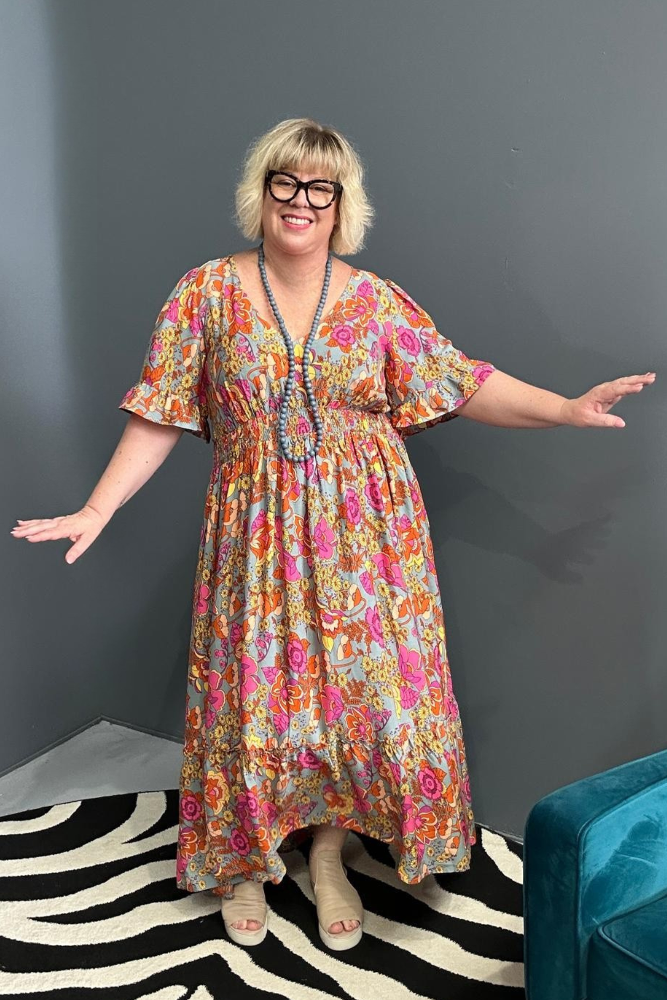 Plus-size sage green maxi dress with a soft, flowing fit.