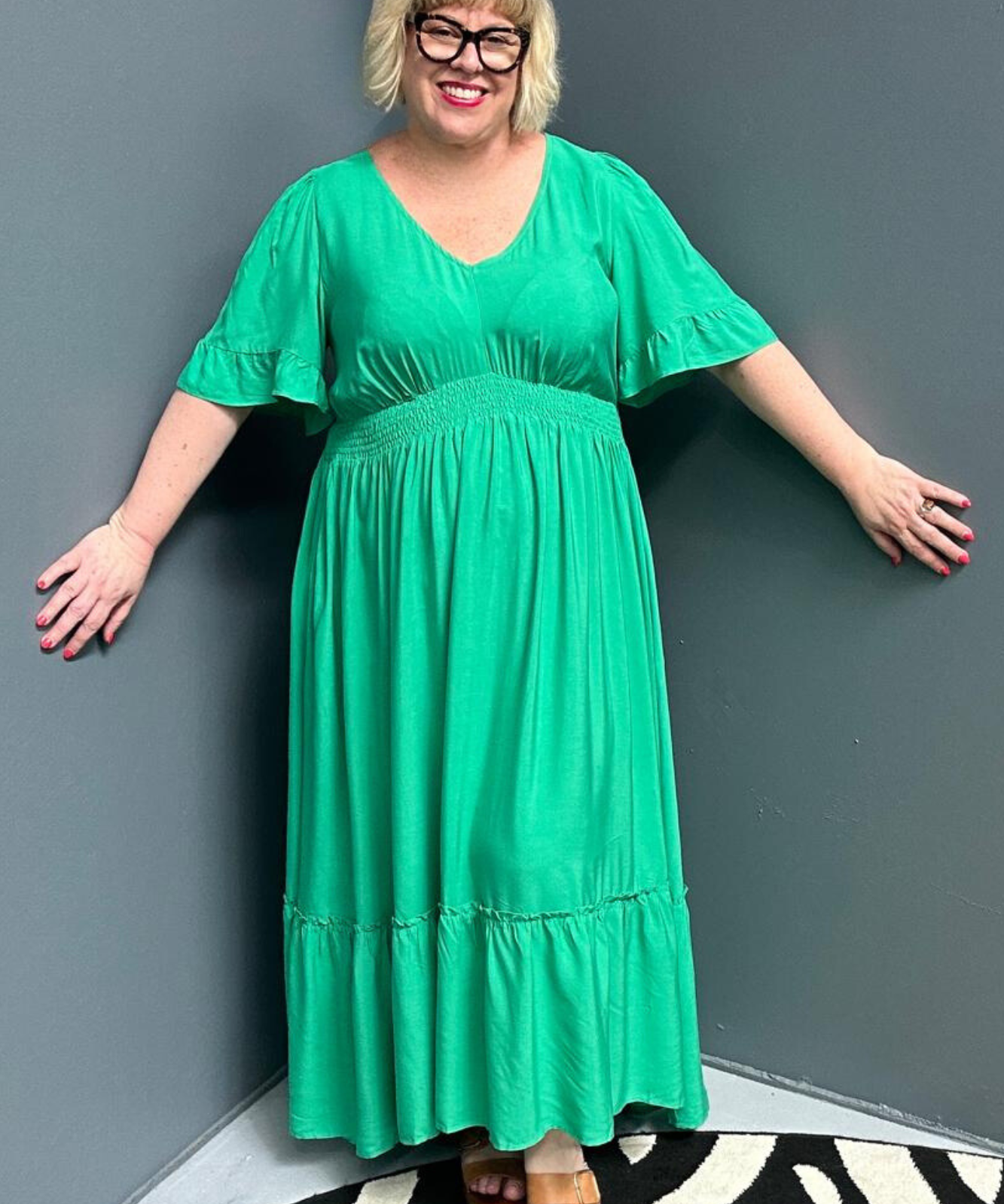 Plus-size jade maxi dress with a soft, flowing silhouette.