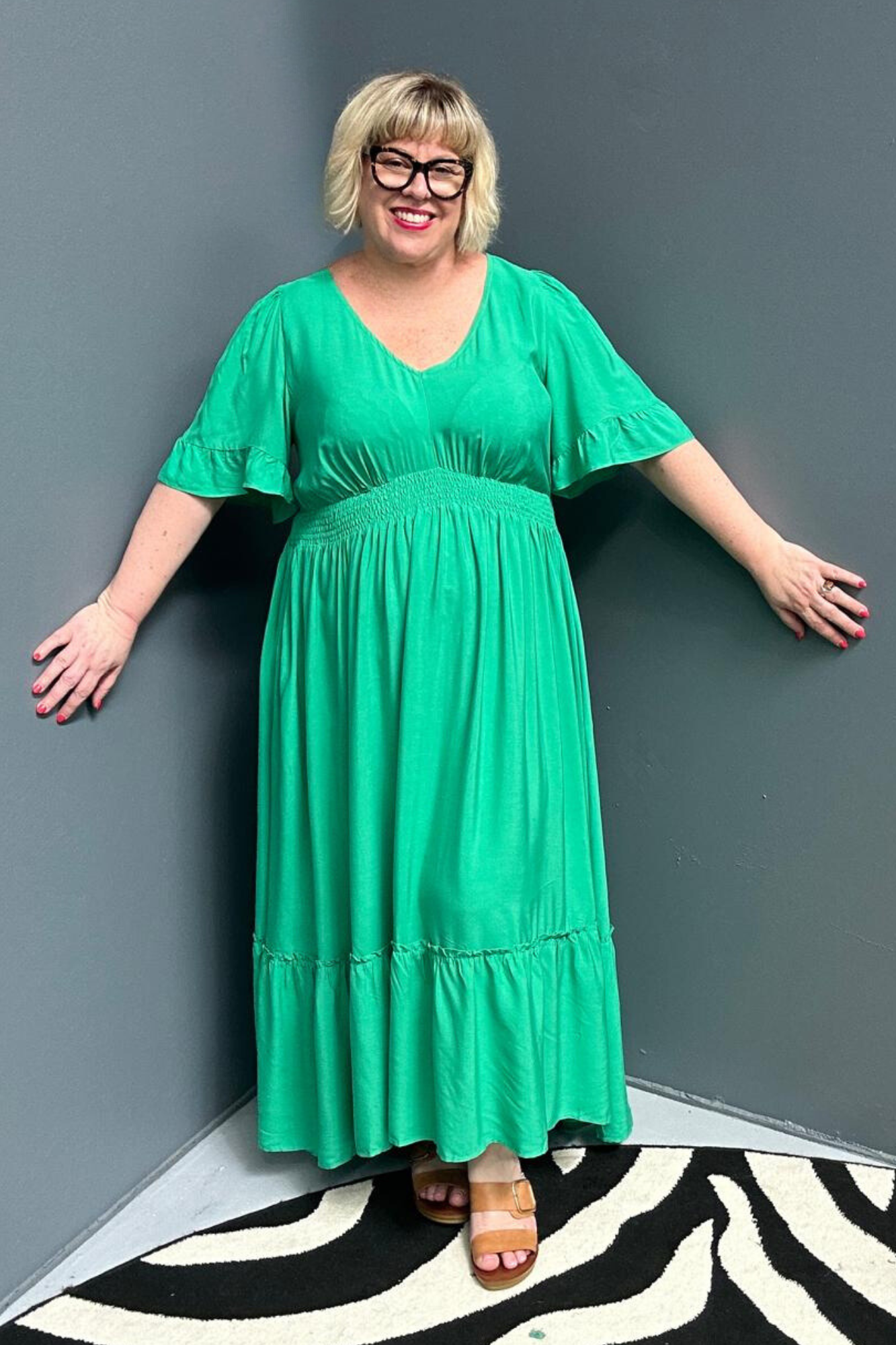 Plus-size jade maxi dress with a soft, flowing silhouette.