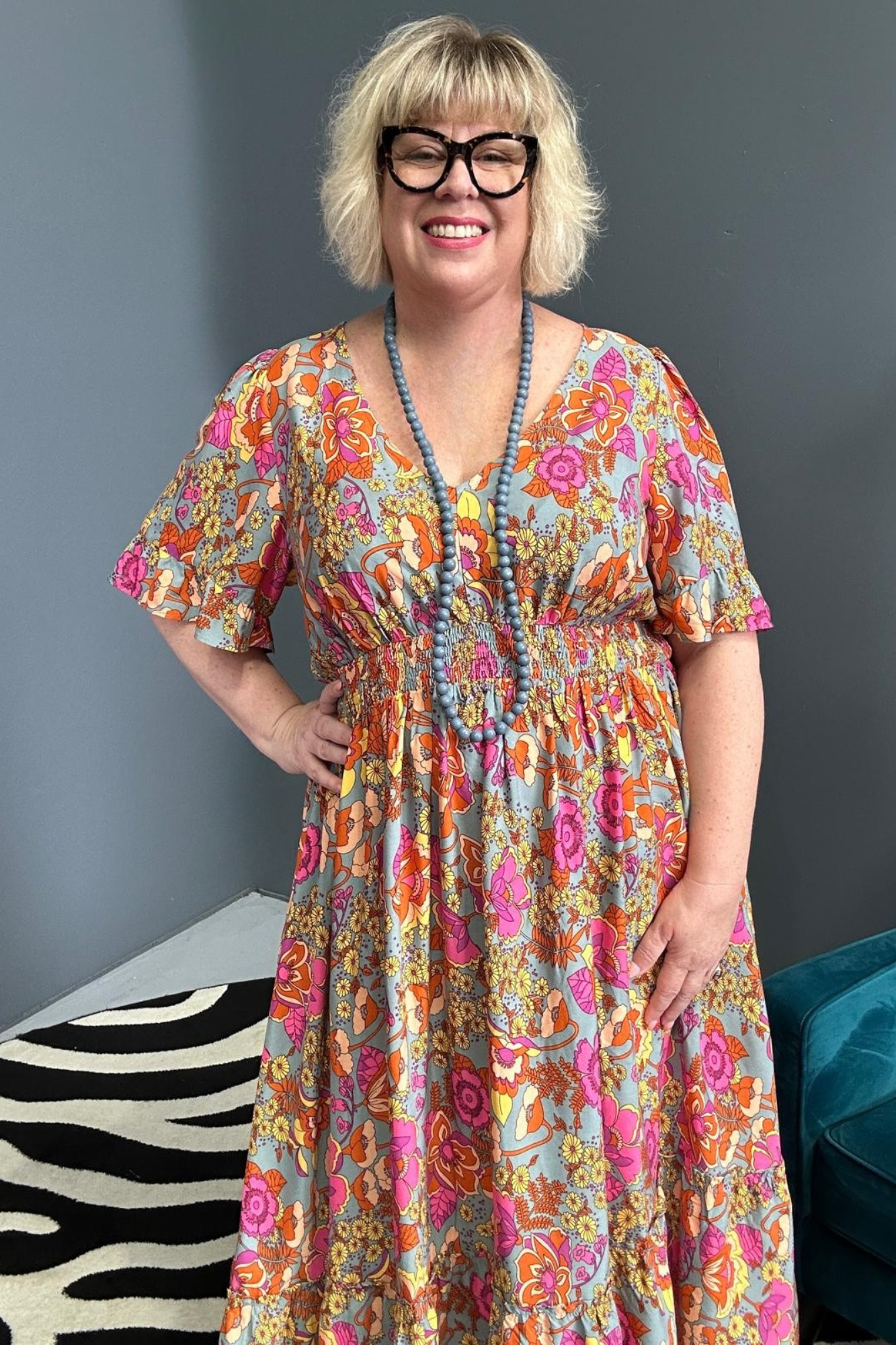 Plus-size sage green maxi dress with a soft, flowing fit.