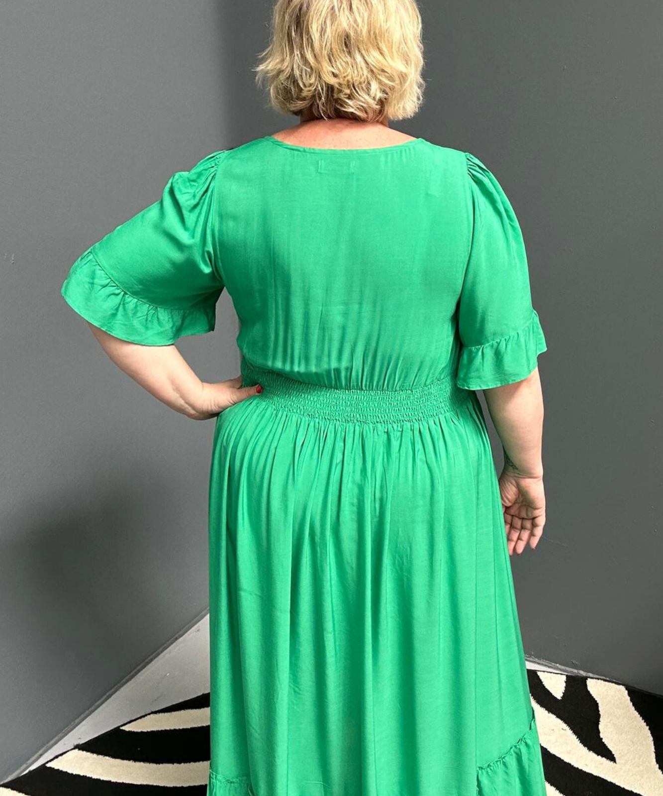 Plus-size jade maxi dress with a soft, flowing silhouette.