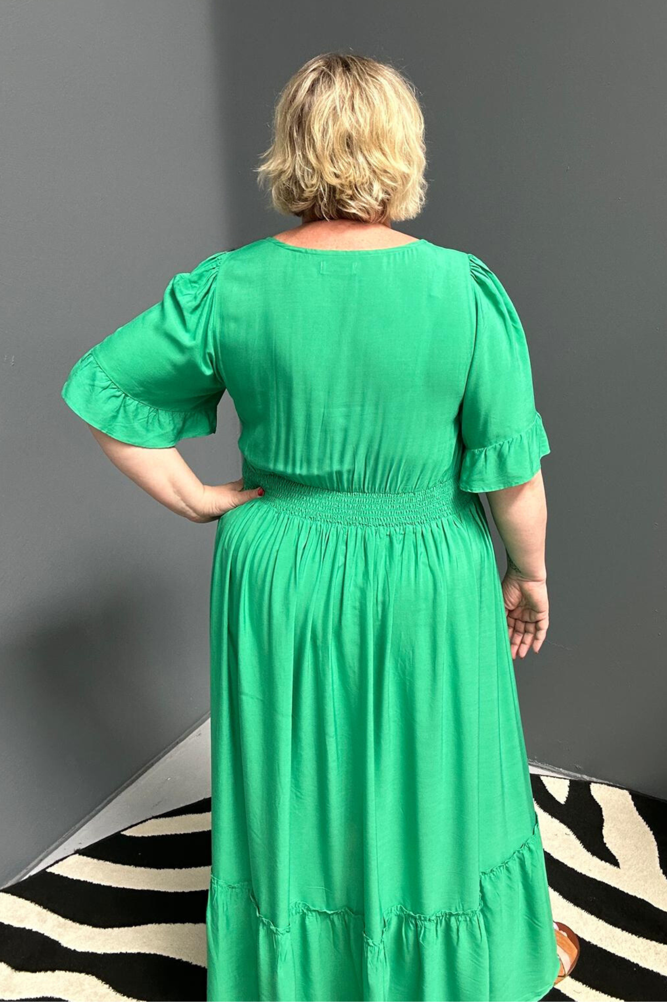 Plus-size jade maxi dress with a soft, flowing silhouette.