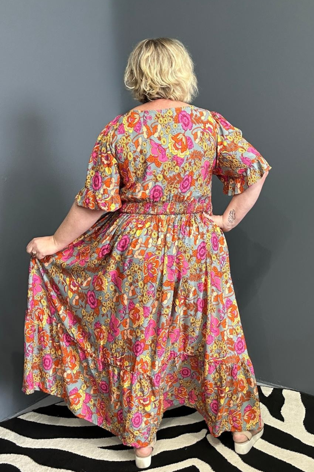 Plus-size sage green maxi dress with a soft, flowing fit.