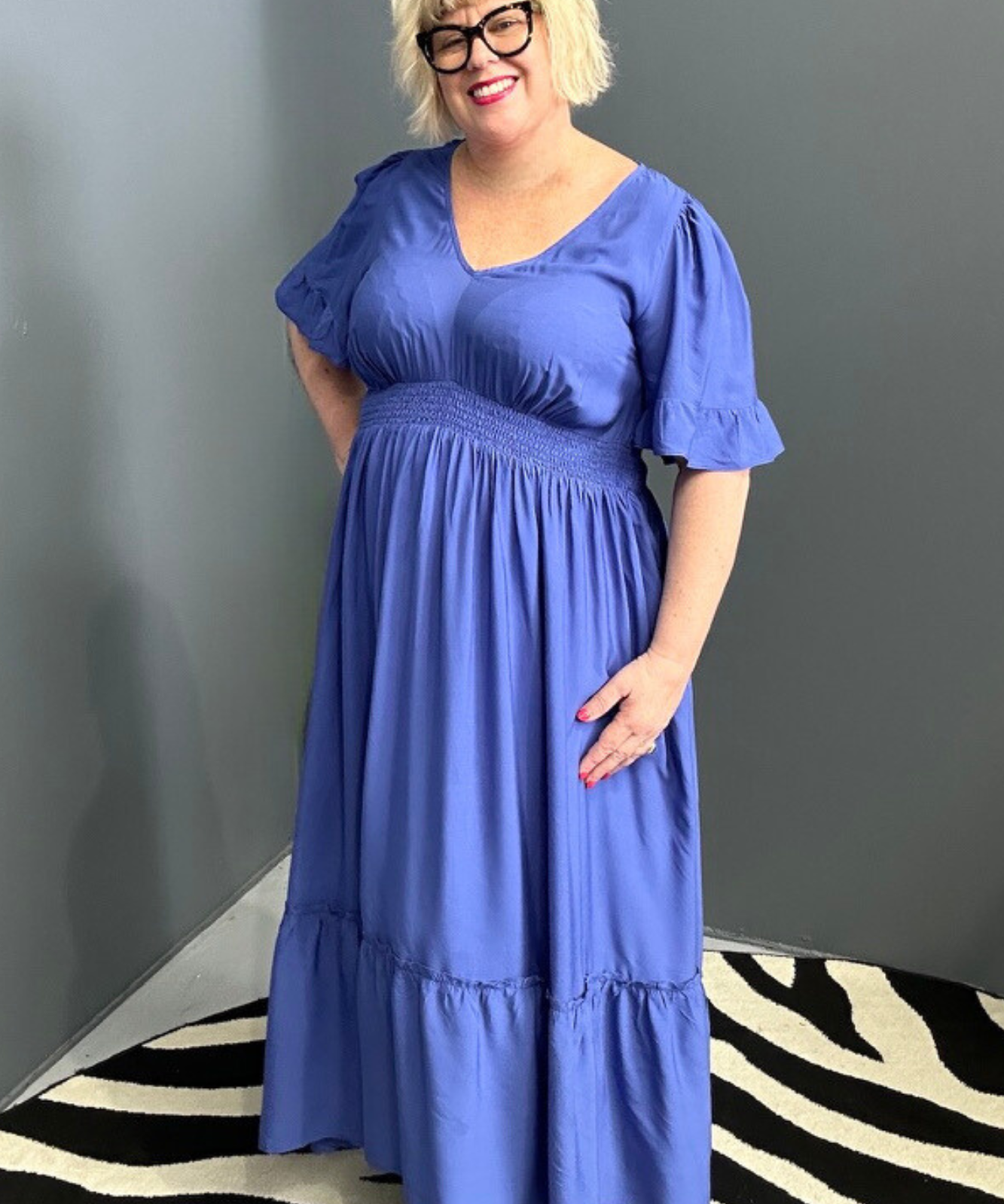Plus-size cobalt maxi dress with a soft, flowing silhouette.