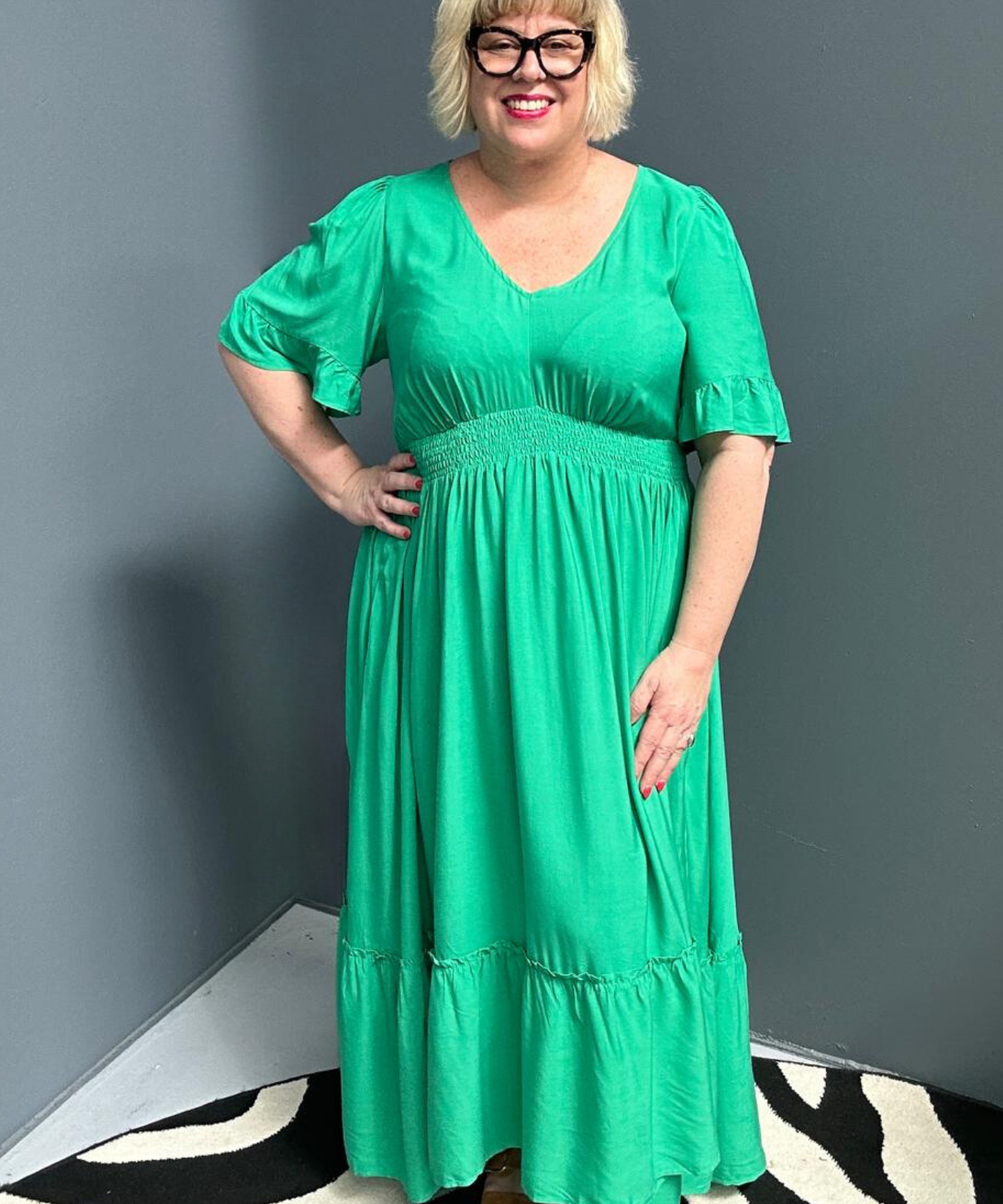 Plus-size jade maxi dress with a soft, flowing silhouette.