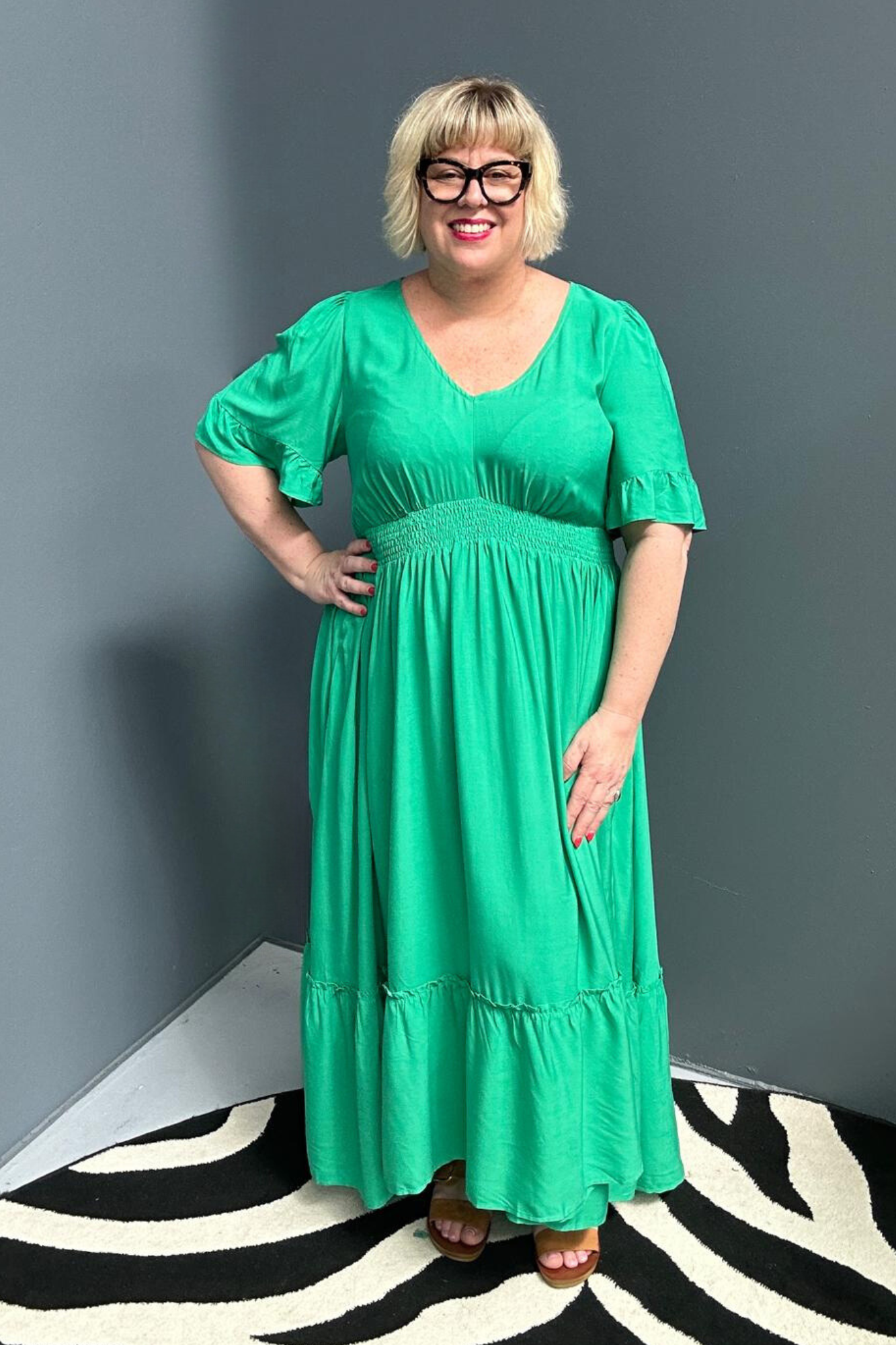 Plus-size jade maxi dress with a soft, flowing silhouette.