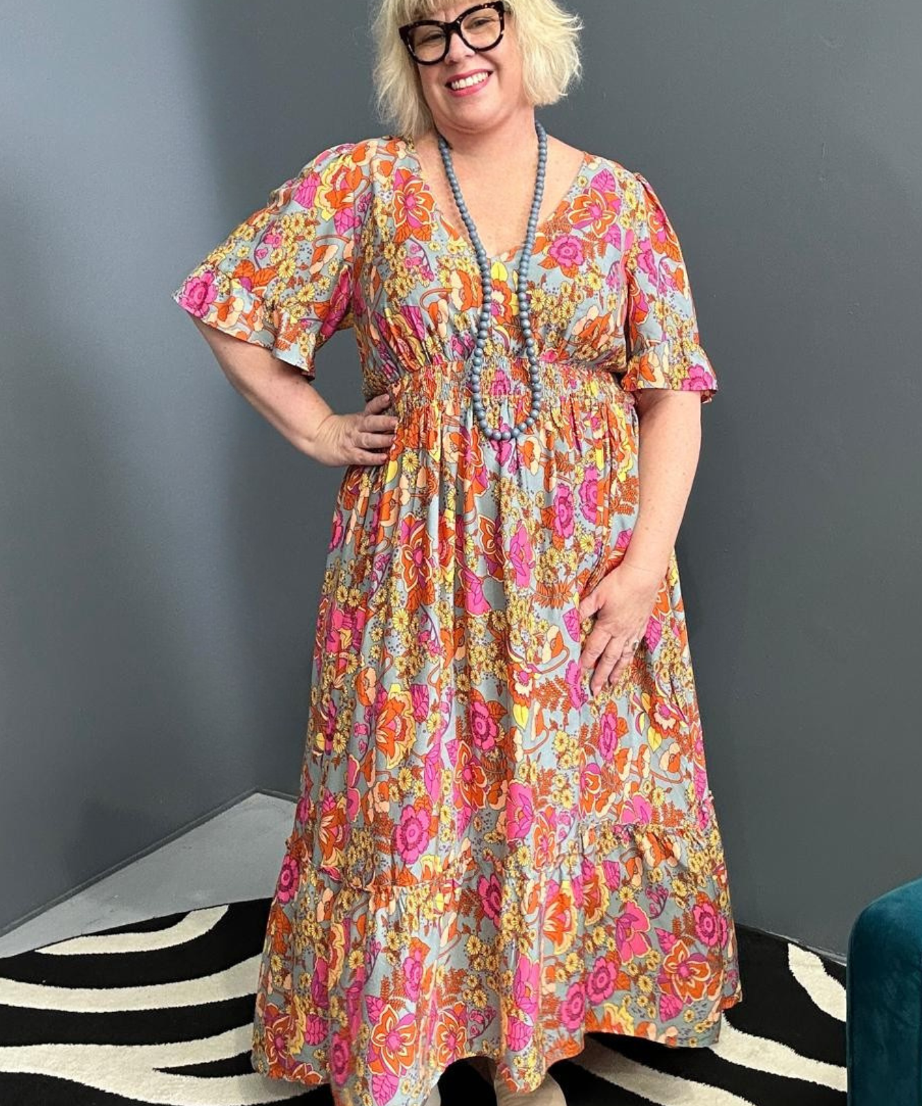 Plus-size sage green maxi dress with a soft, flowing fit.