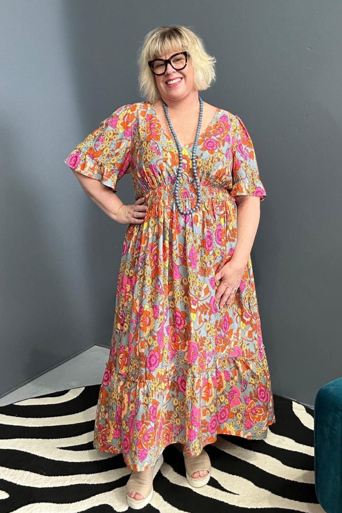Plus-size sage green maxi dress with a soft, flowing fit.