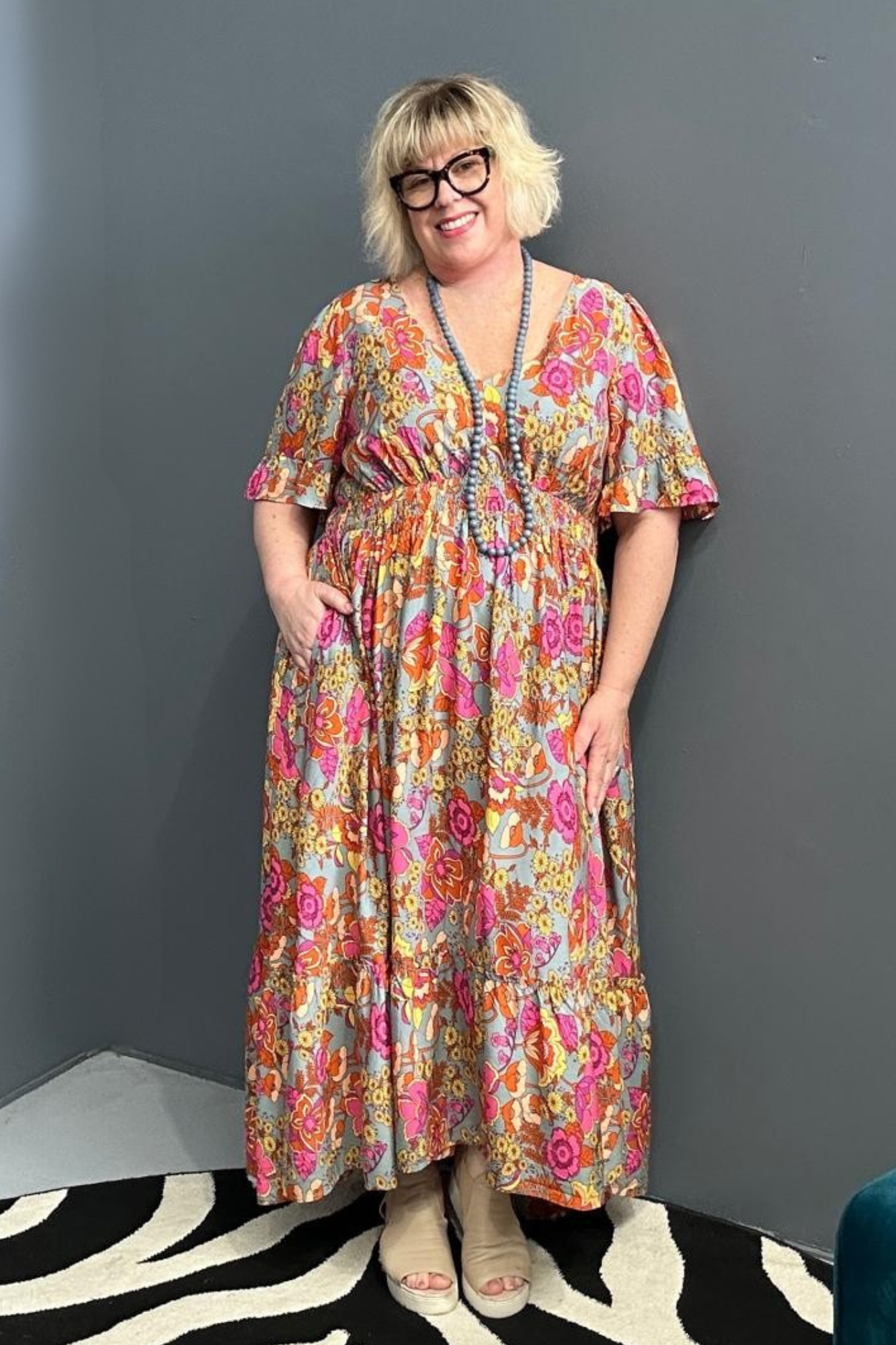 Plus-size sage green maxi dress with a soft, flowing fit.