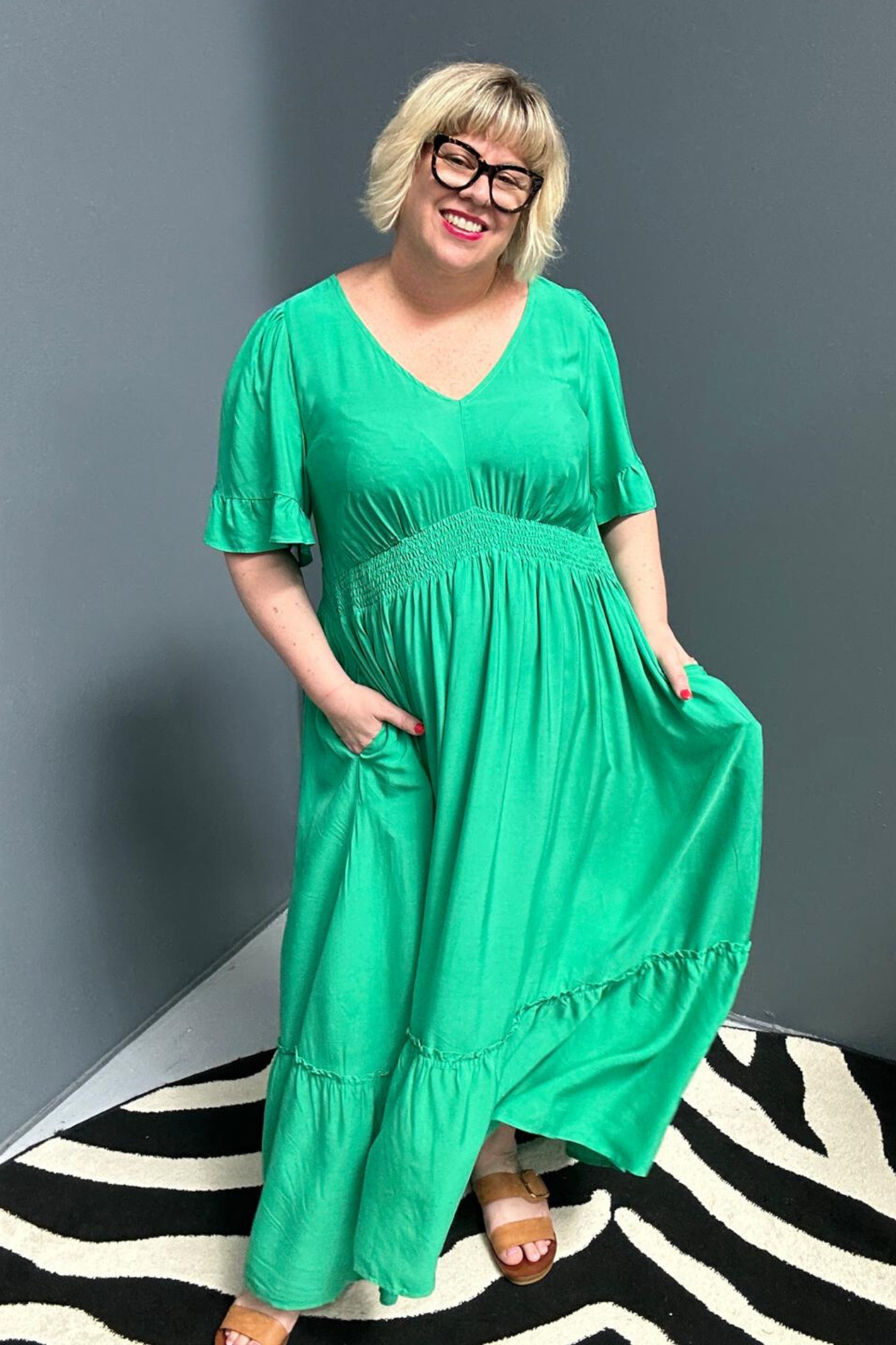 Plus-size jade maxi dress with a soft, flowing silhouette.