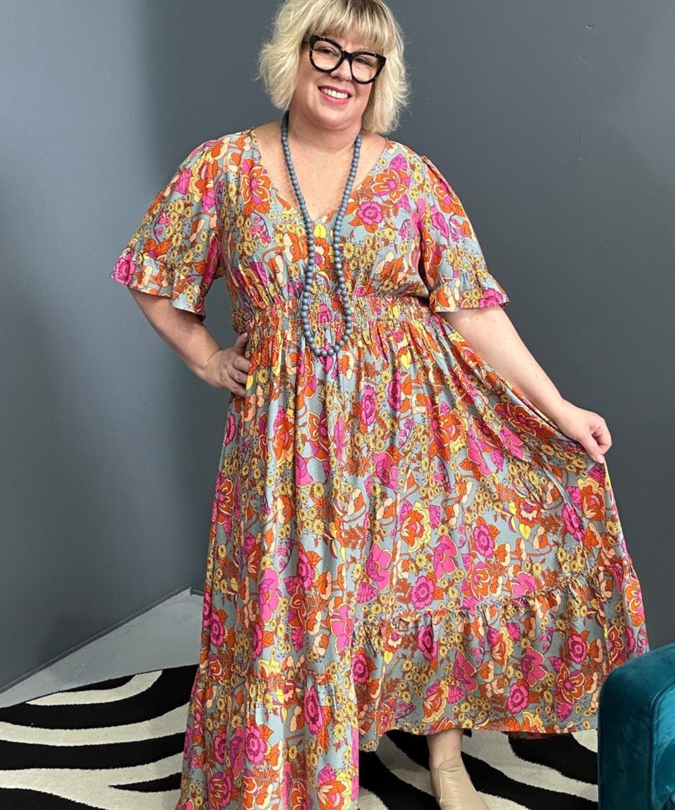 Plus-size sage green maxi dress with a soft, flowing fit.