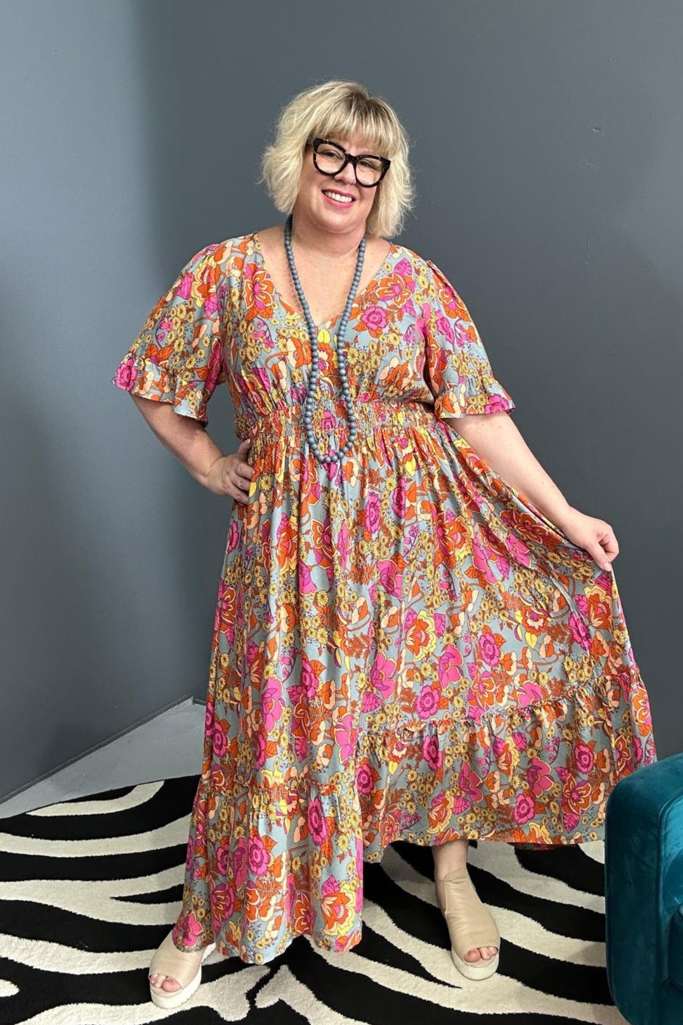 Plus-size sage green maxi dress with a soft, flowing fit.