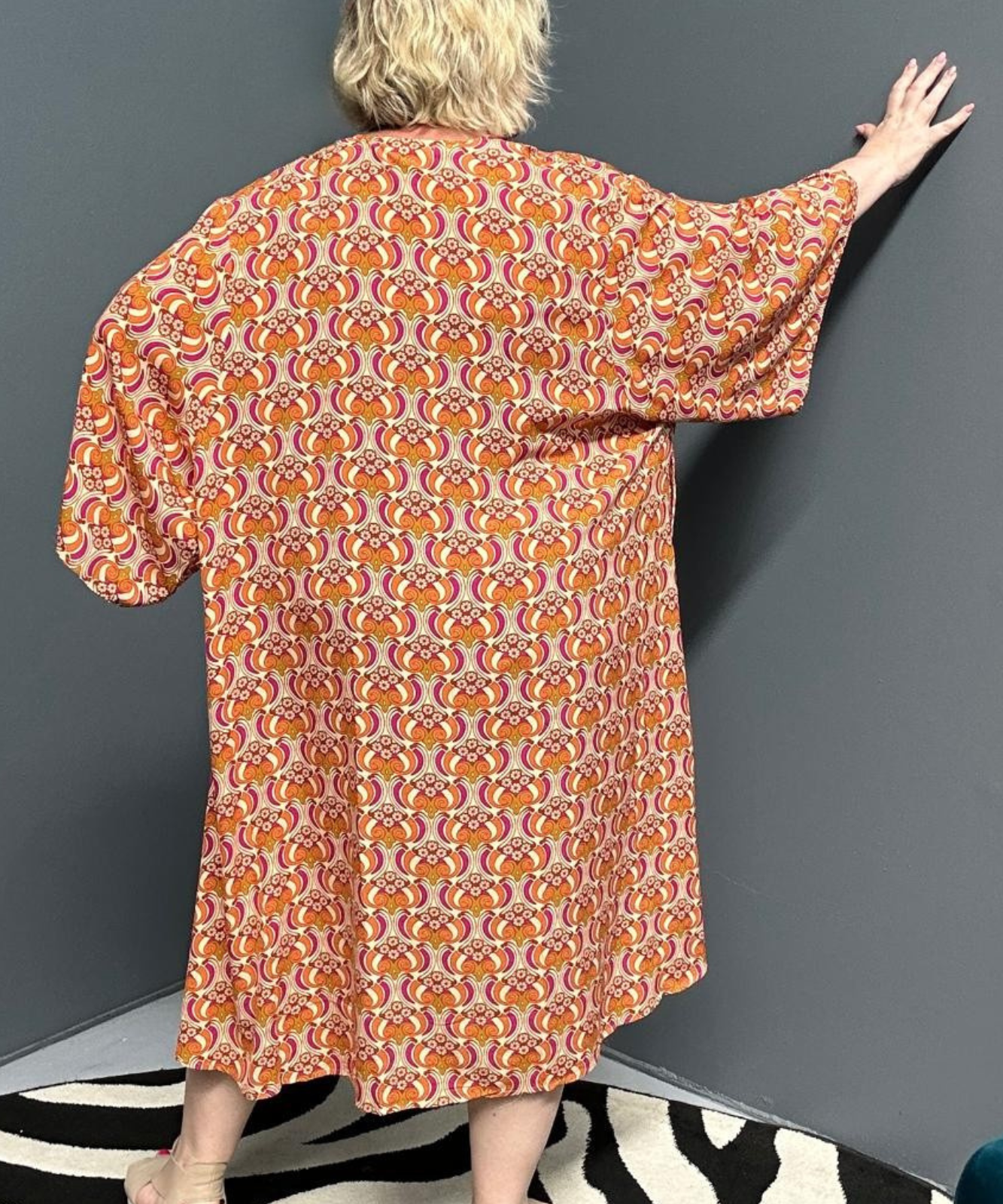 Flowy kimono duster with a vibrant Orange Swirl print.