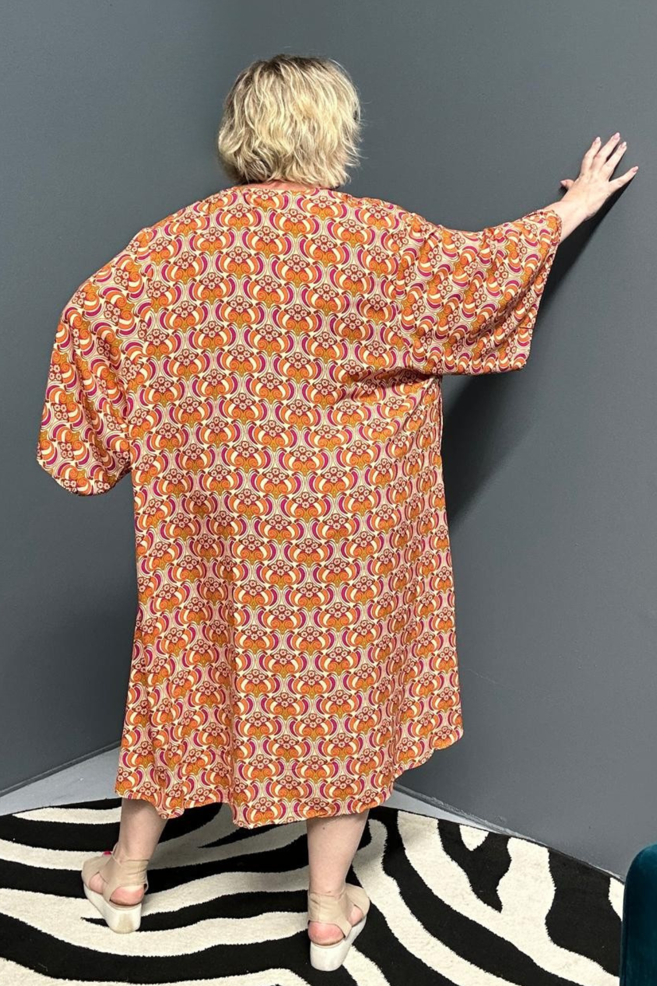 Flowy kimono duster with a vibrant Orange Swirl print.