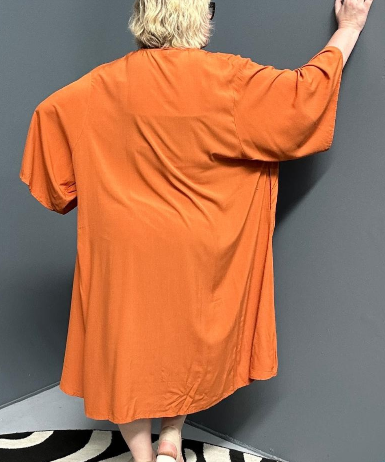 Flowy kimono duster in a deep rust shade.