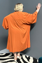 Flowy kimono duster in a deep rust shade.