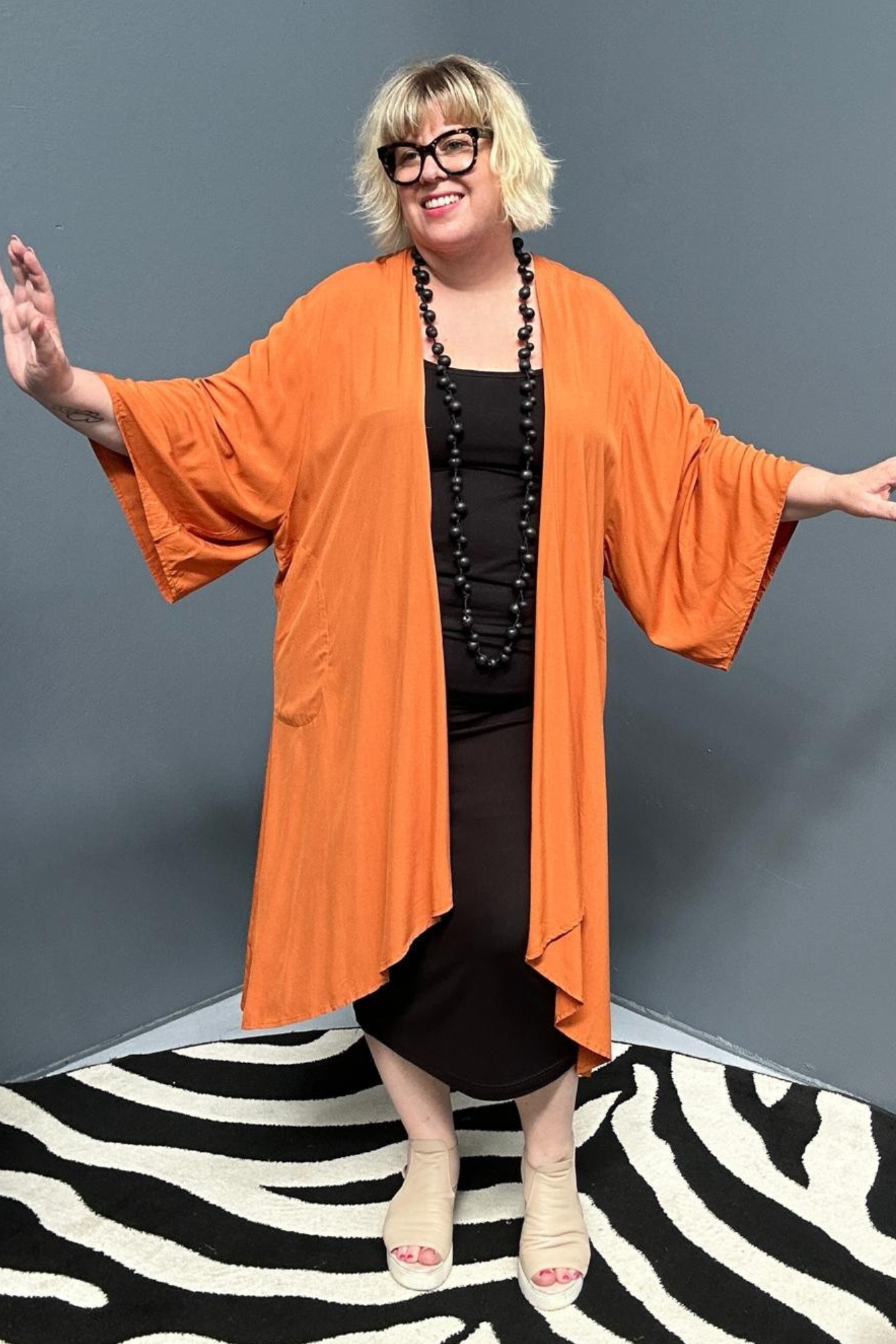 Flowy kimono duster in a deep rust shade.