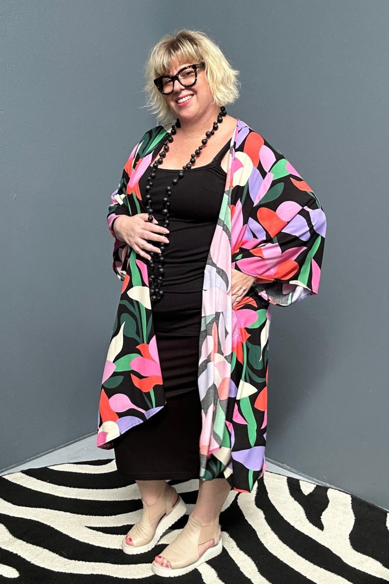 kimono duster with a Black/Pink Lily print and a flowing silhouette.