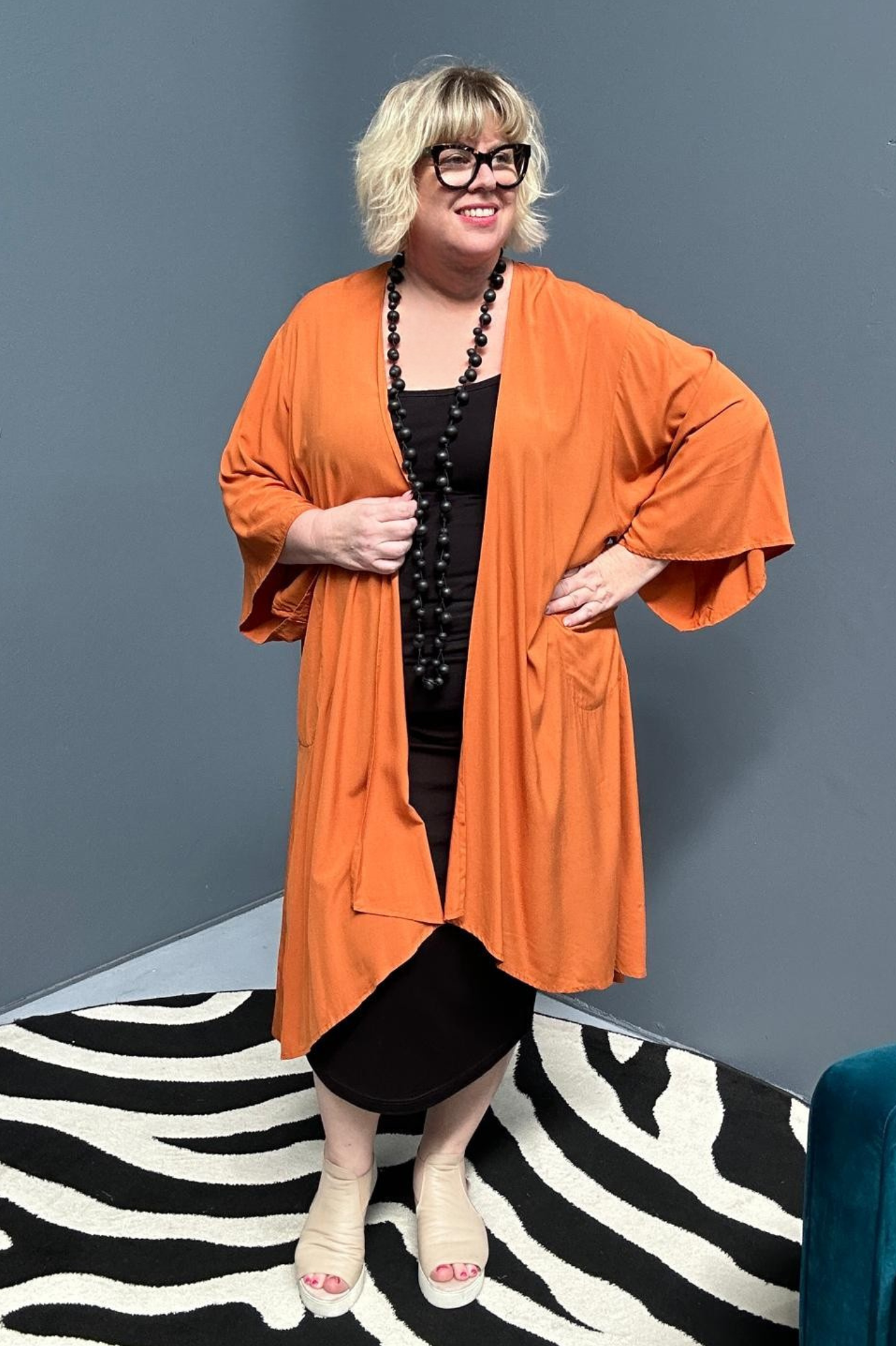 Flowy kimono duster in a deep rust shade.