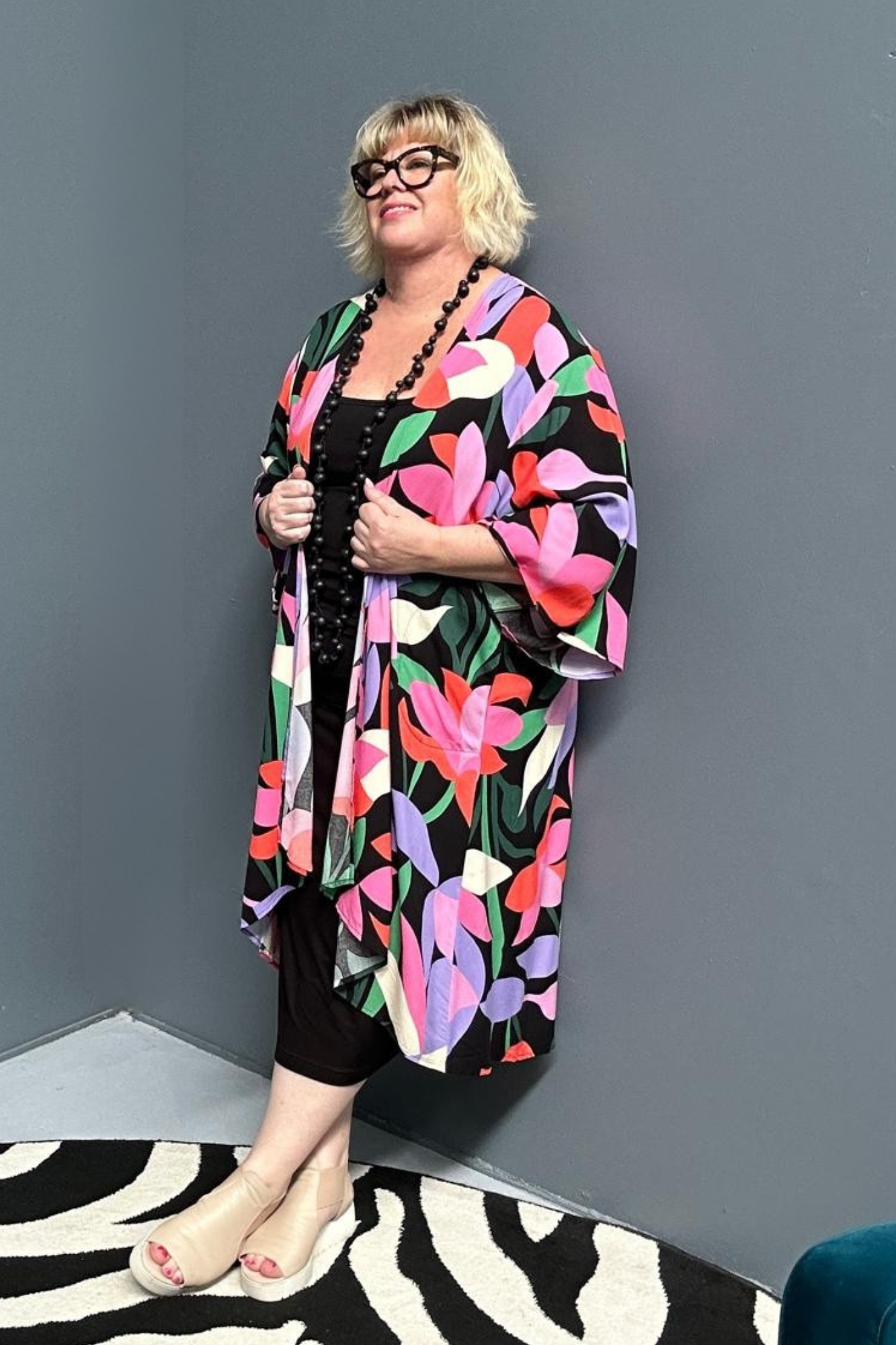 kimono duster with a Black/Pink Lily print and a flowing silhouette.