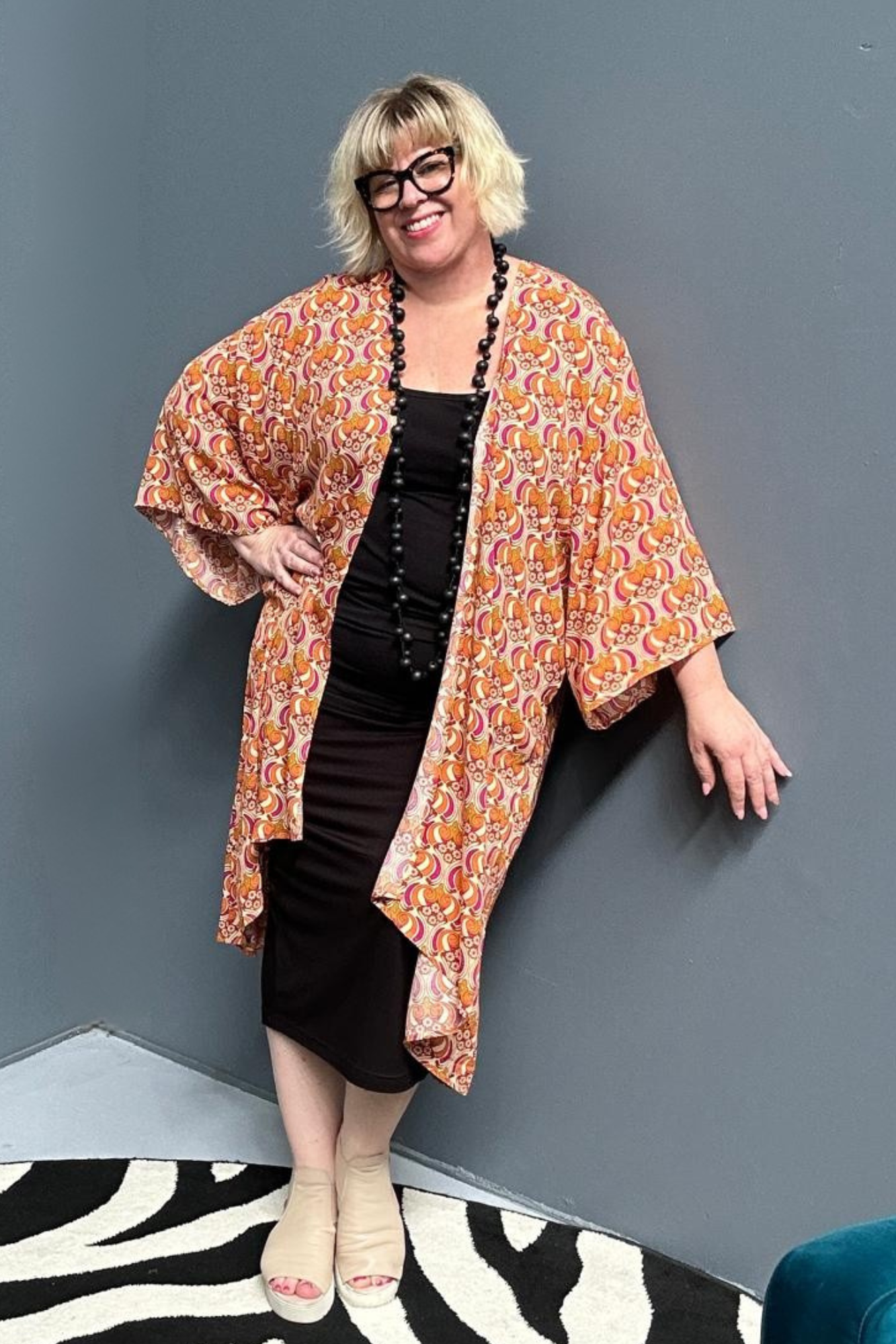 Flowy kimono duster with a vibrant Orange Swirl print.