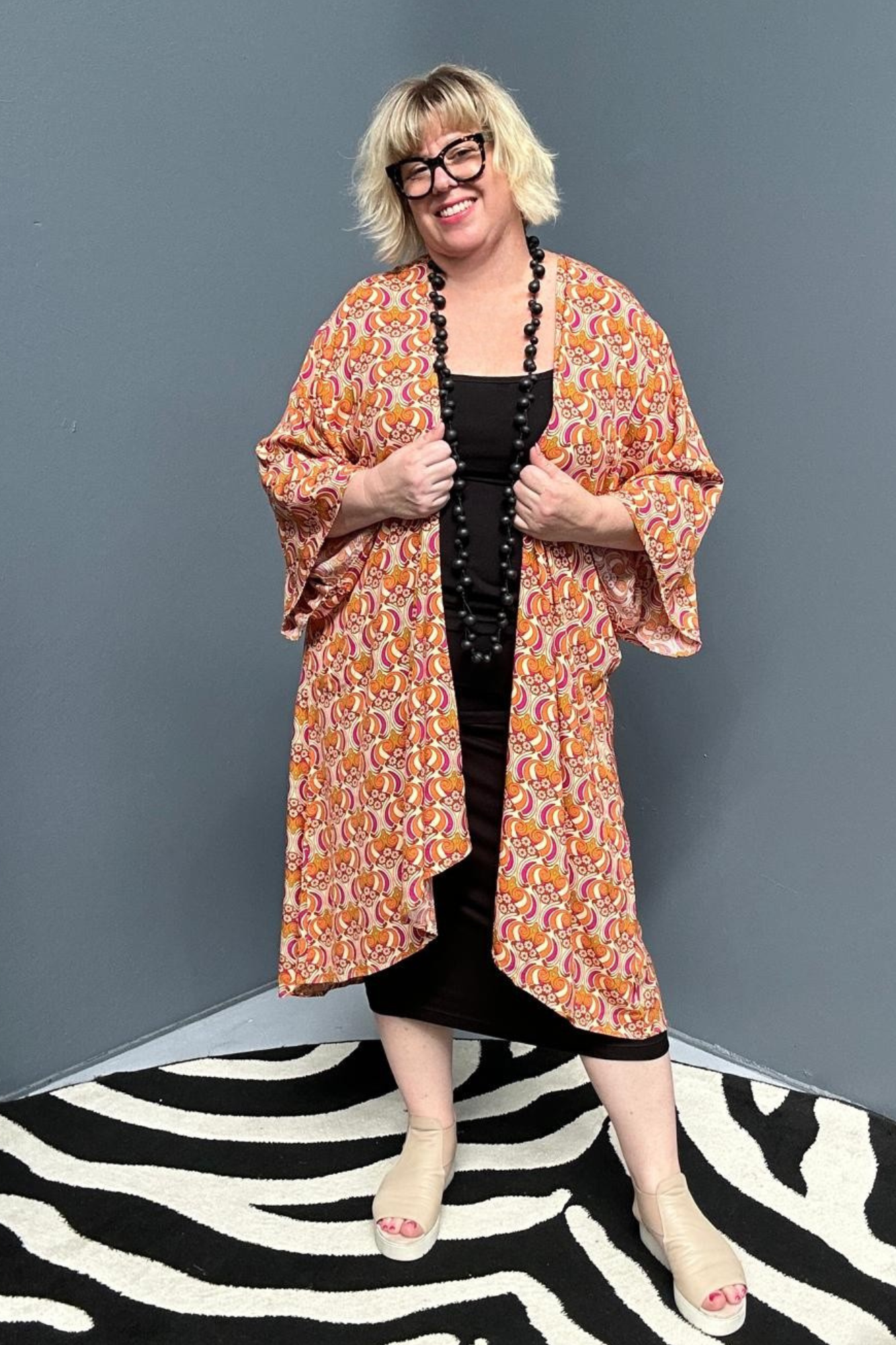 Flowy kimono duster with a vibrant Orange Swirl print.