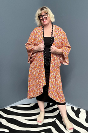 Flowy kimono duster with a vibrant Orange Swirl print.