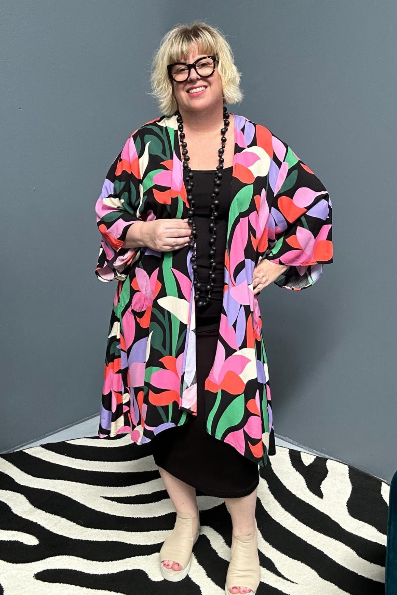 kimono duster with a Black/Pink Lily print and a flowing silhouette.