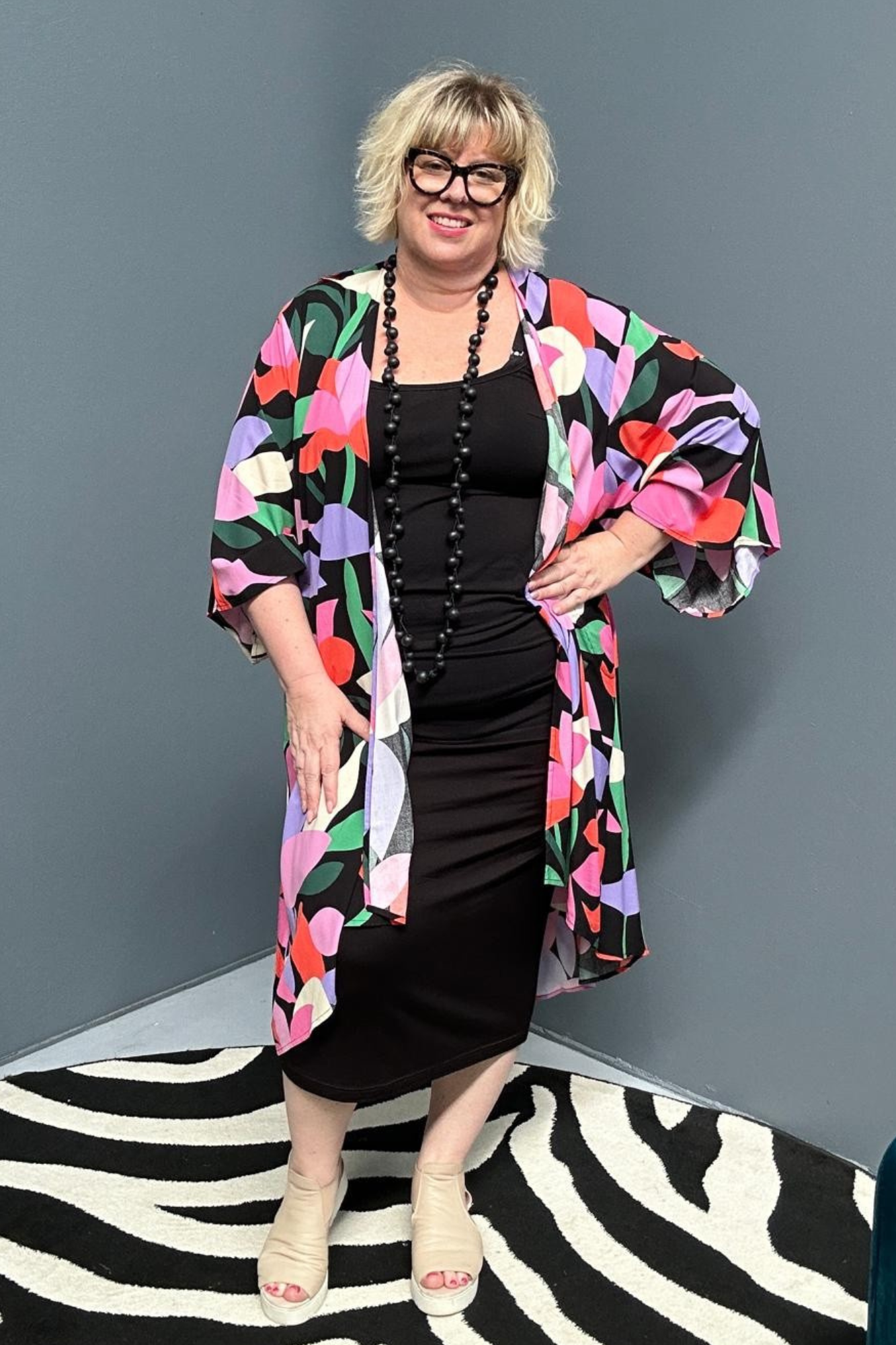 kimono duster with a Black/Pink Lily print and a flowing silhouette.