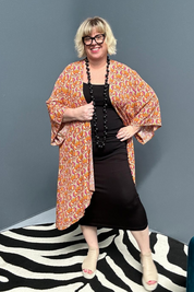 Flowy kimono duster with a vibrant Orange Swirl print.