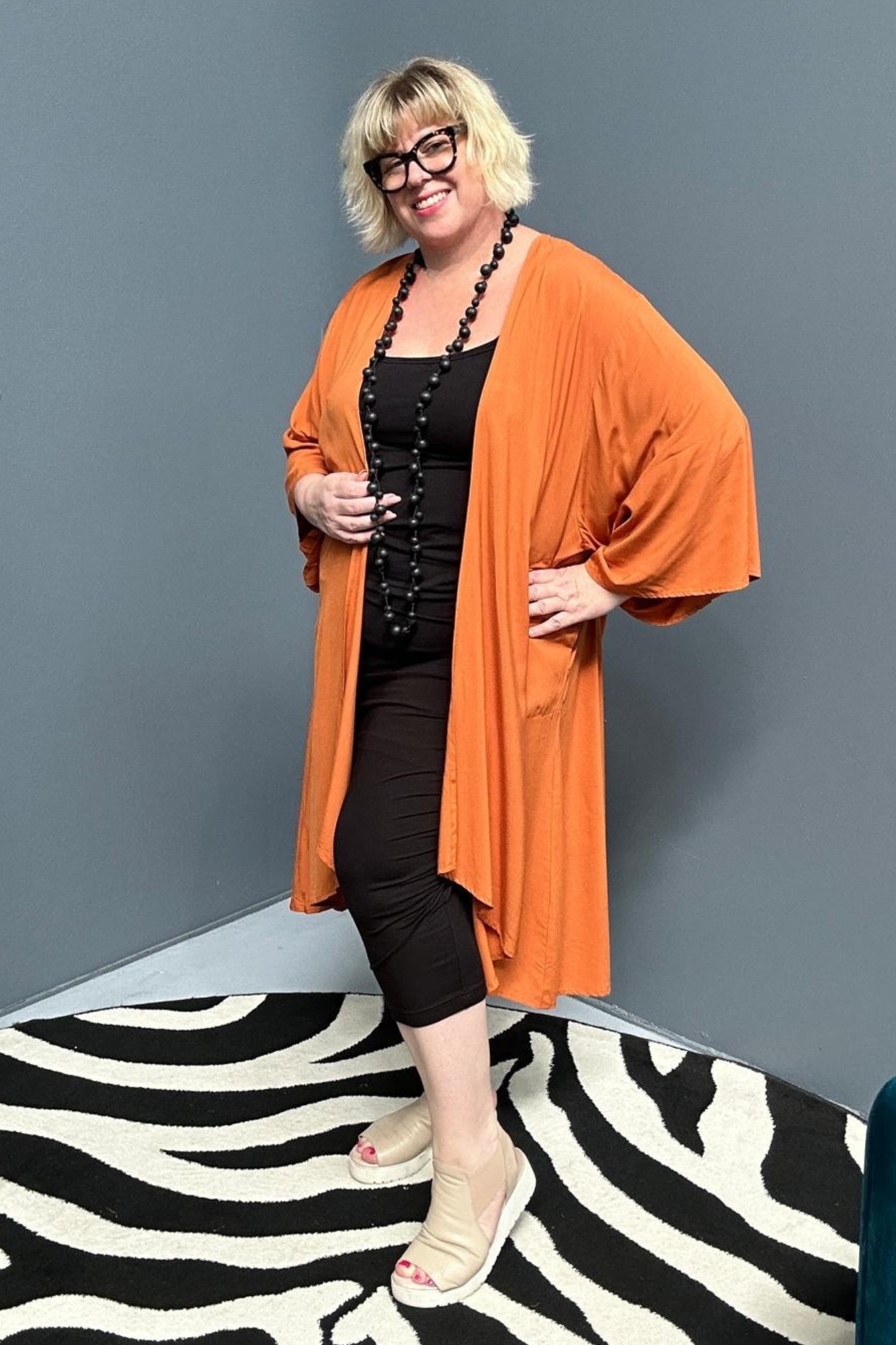 Flowy kimono duster in a deep rust shade.