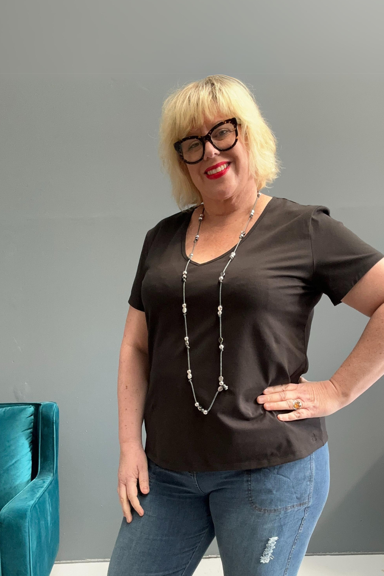 Classic black cotton lycra tee for plus size women, versatile for everyday wear and layering.