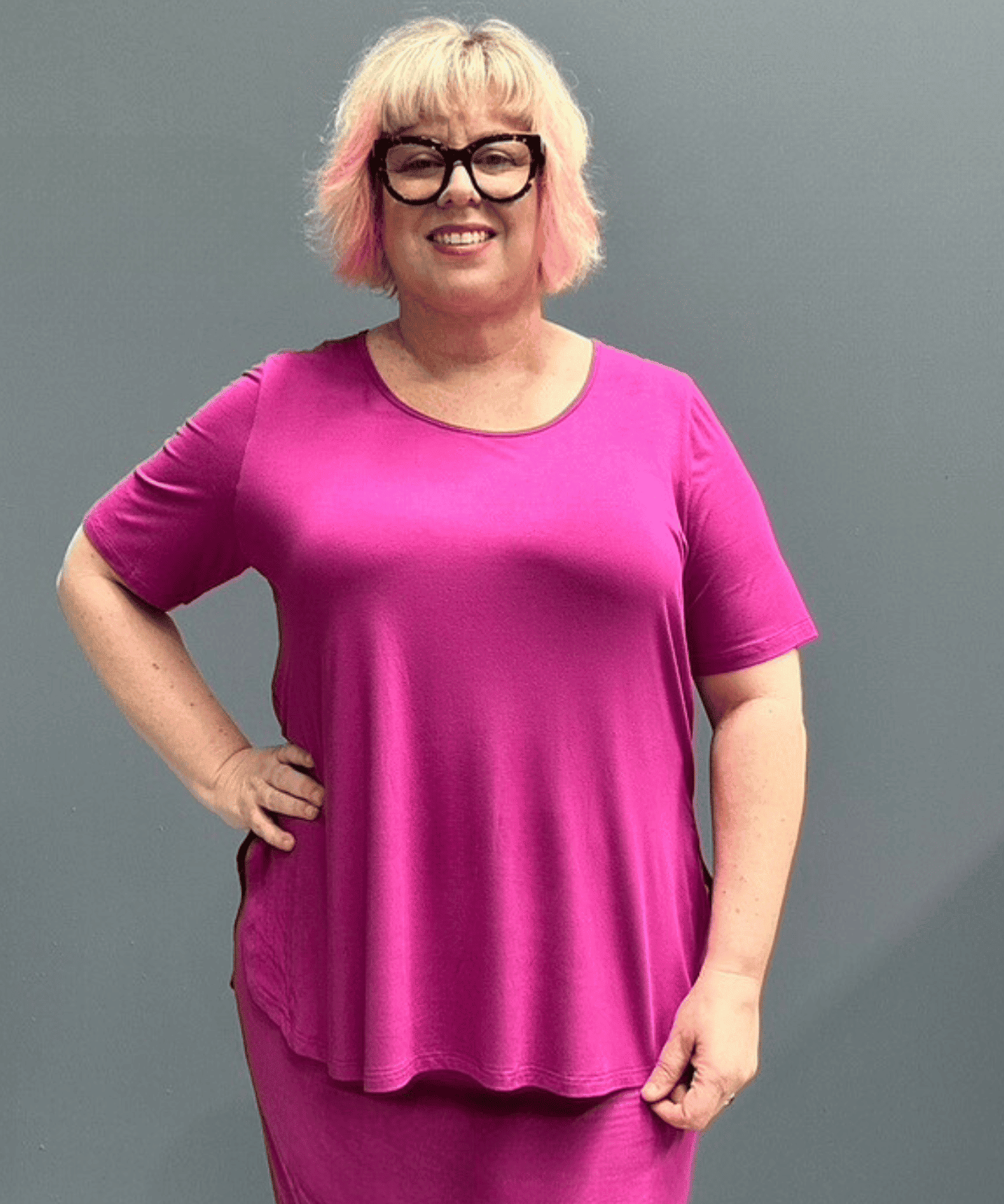 Plus-size fuchsia short-sleeve bamboo top with a relaxed fit.